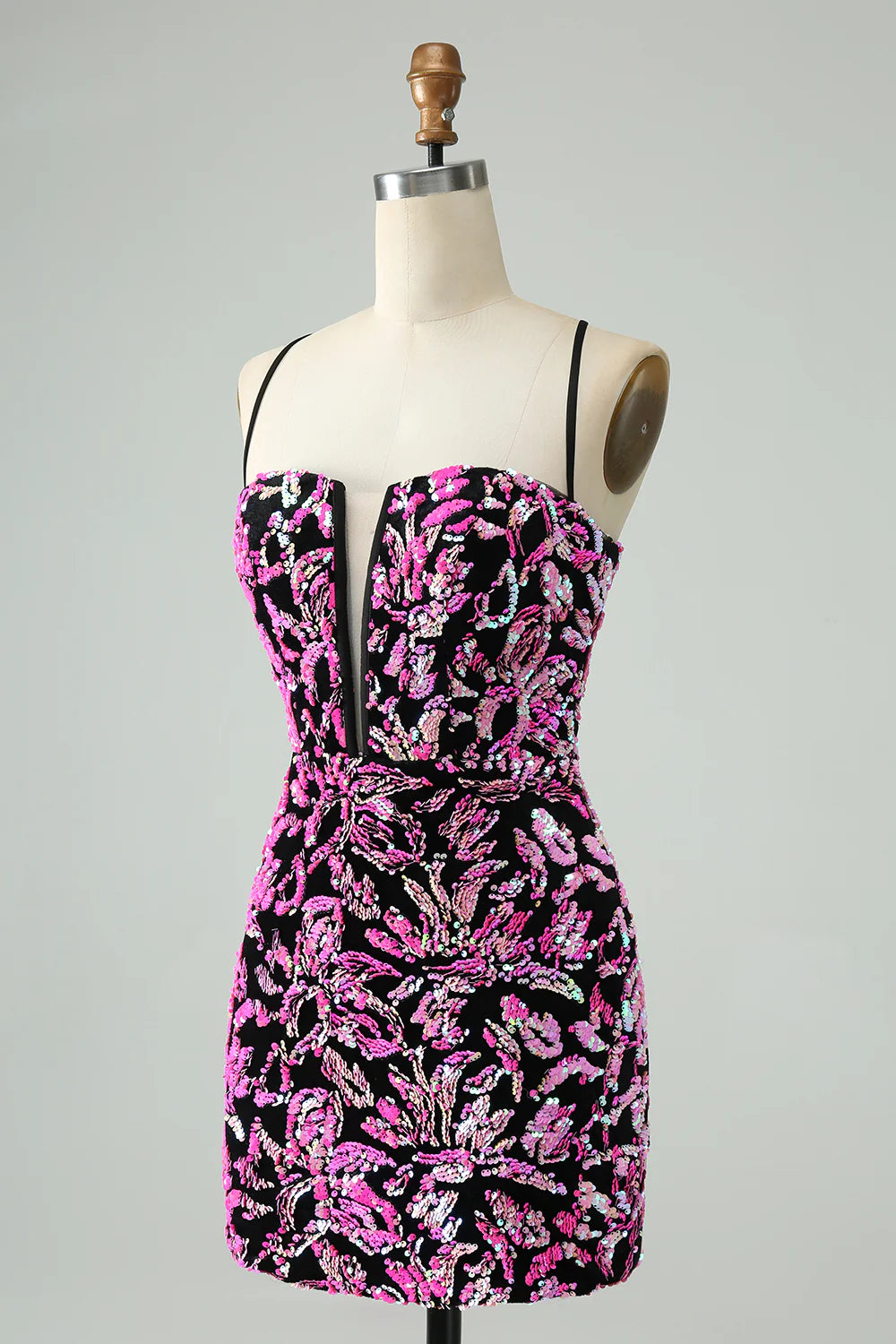 Model wearing a fuchsia black sparkly sequin bodycon short homecoming dress.