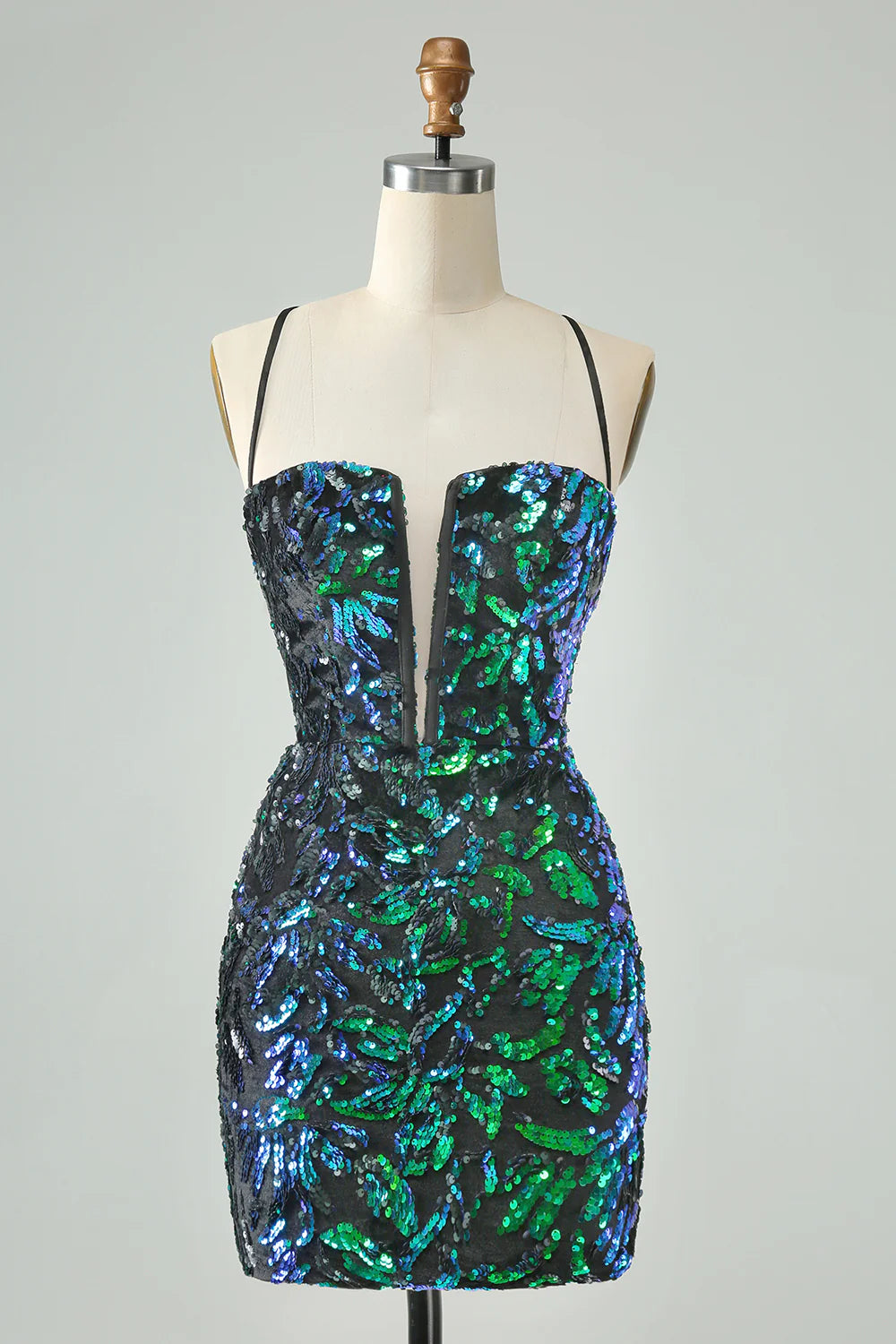 Model wearing a green black sparkly sequin bodycon short homecoming dress.