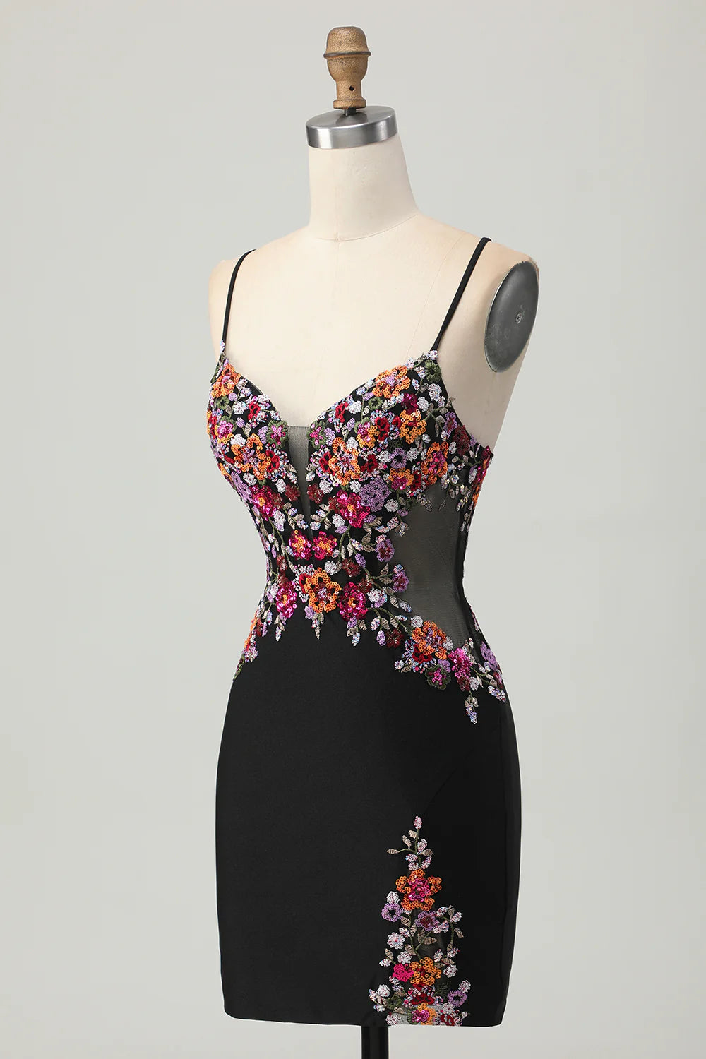 Side view of the black floral sequin short dress, showing its fitted design.