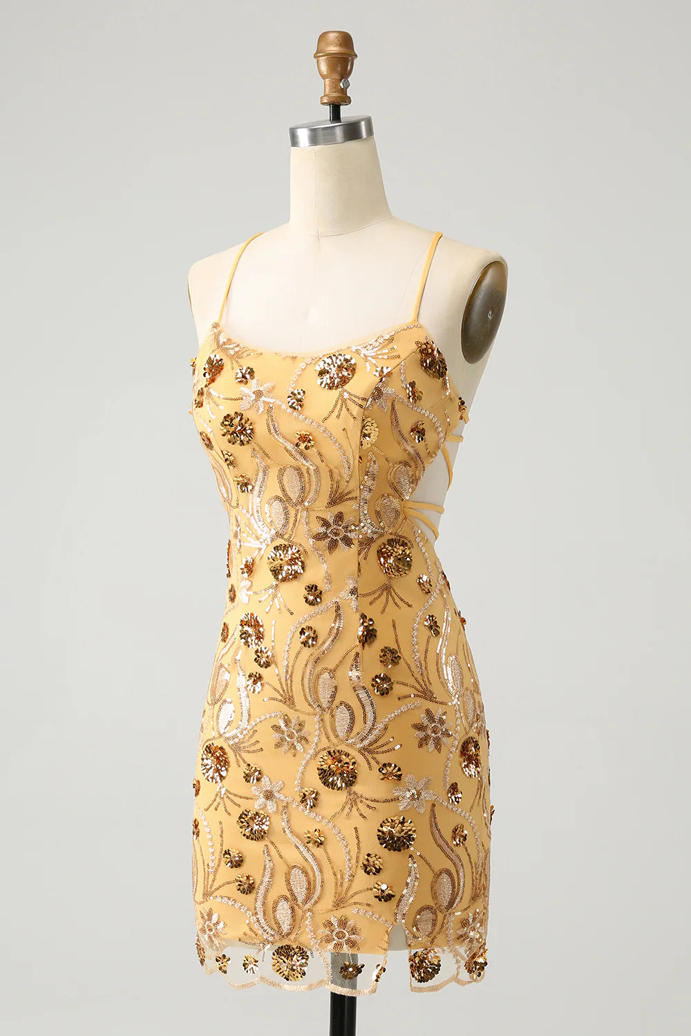 Side view of a model wearing the yellow sequin short dress.