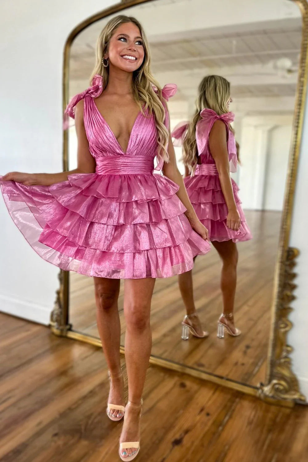 Side profile of the elegant deep V-neck satin homecoming dress.