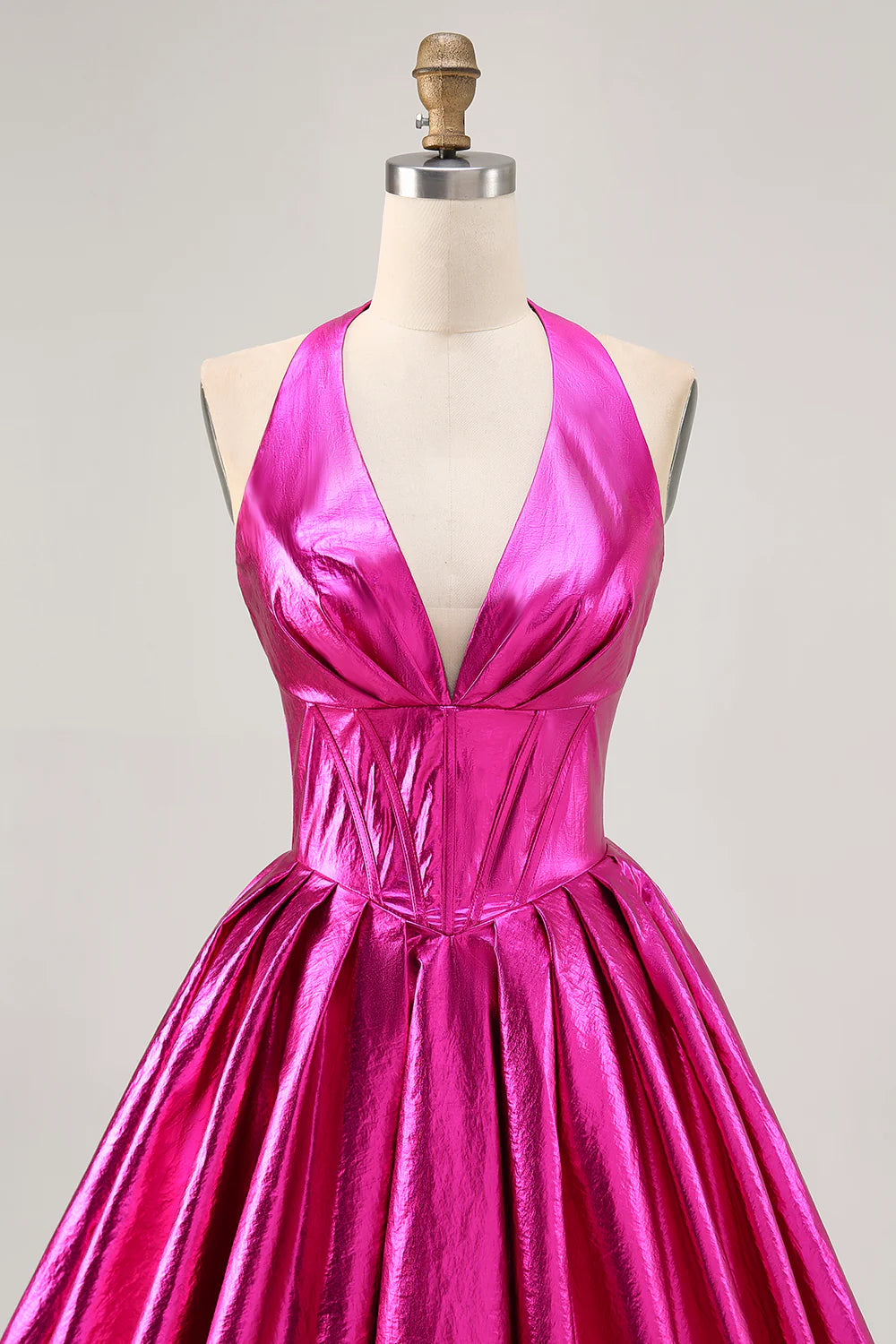 Fuchsia A-line halter backless homecoming dress with corset and ruched details.