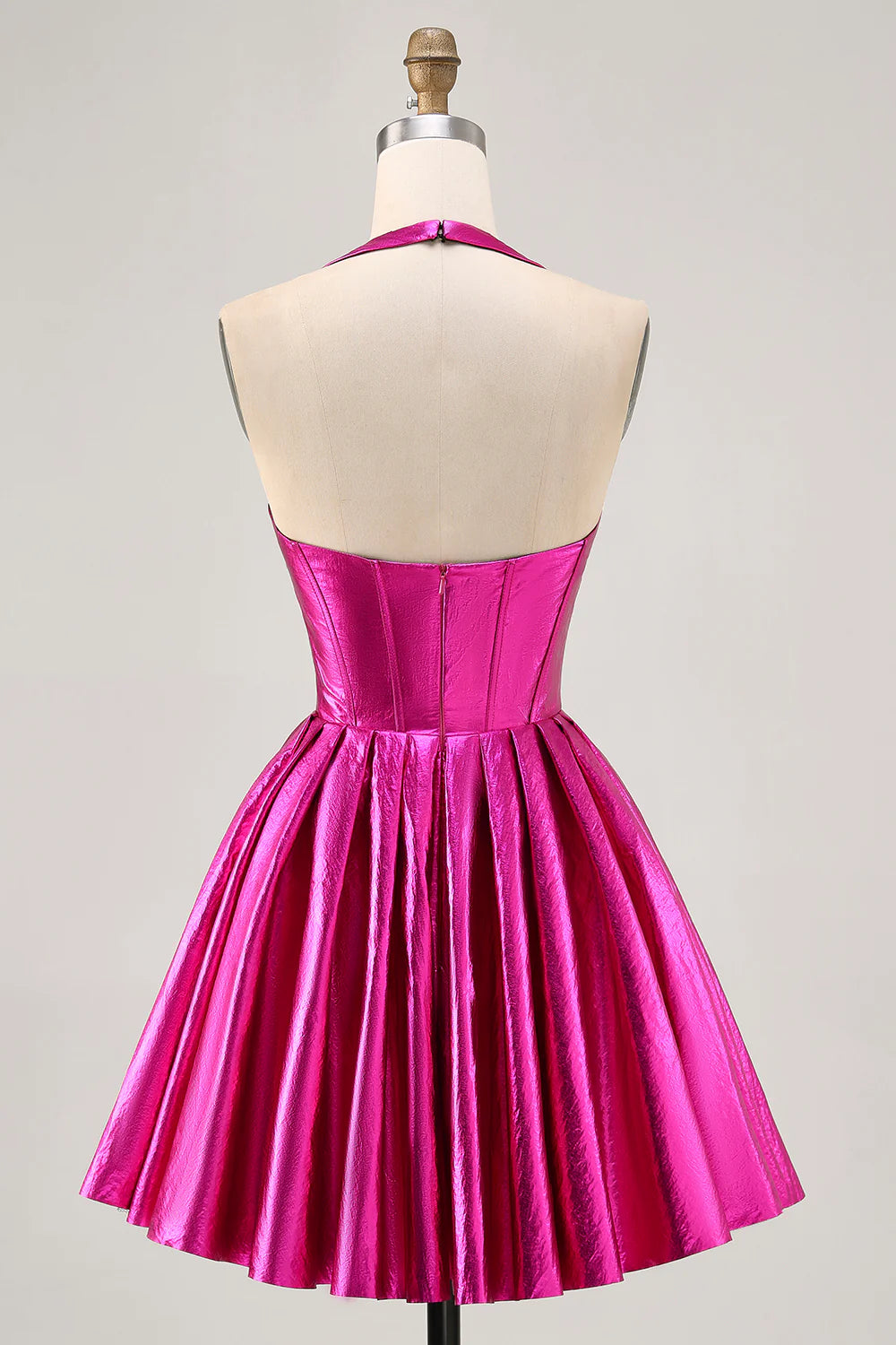 Close-up of the corset bodice and ruched detailing on the fuchsia halter dress.
