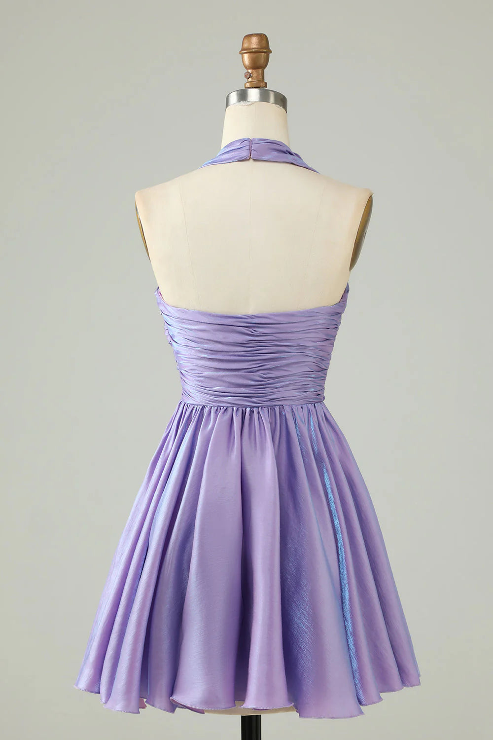 Back view of purple halter homecoming dress showcasing open back design.
