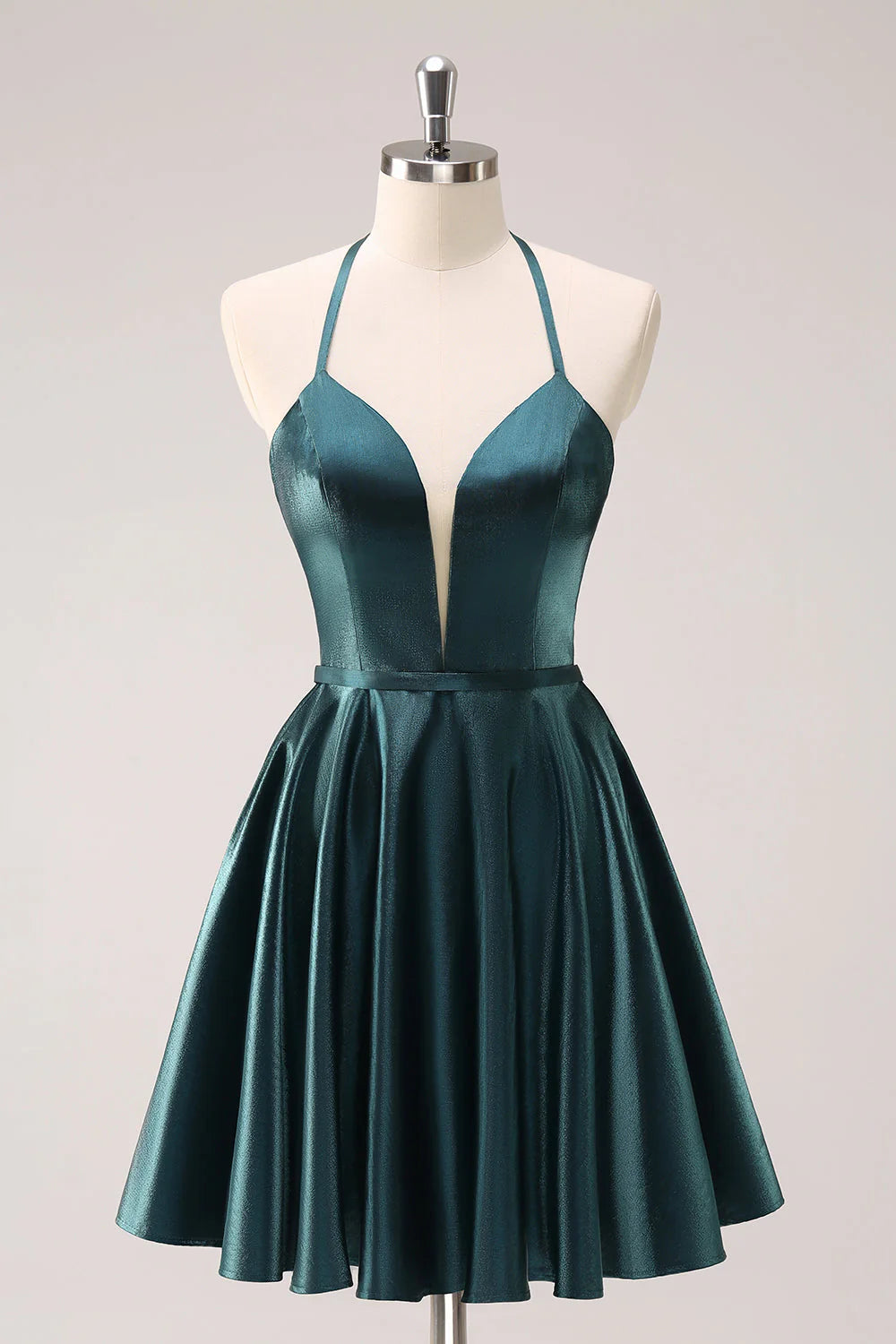 Peacock blue A-line halter homecoming dress with lace-up back, front view.