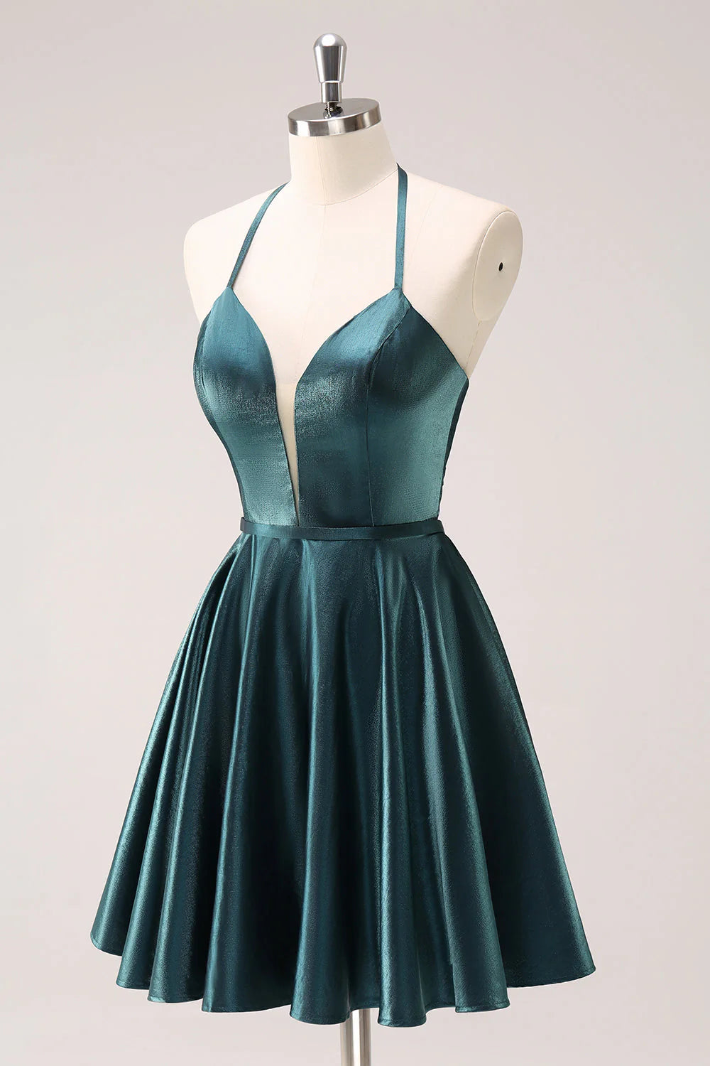 Back view of peacock blue homecoming dress showing lace-up detail.