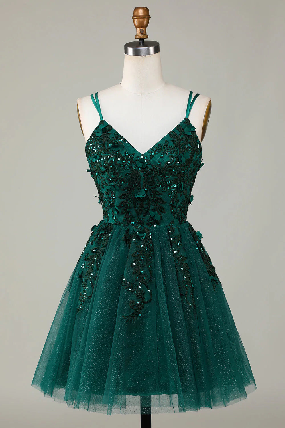 Dark green A-line short homecoming dress with spaghetti straps and beading.