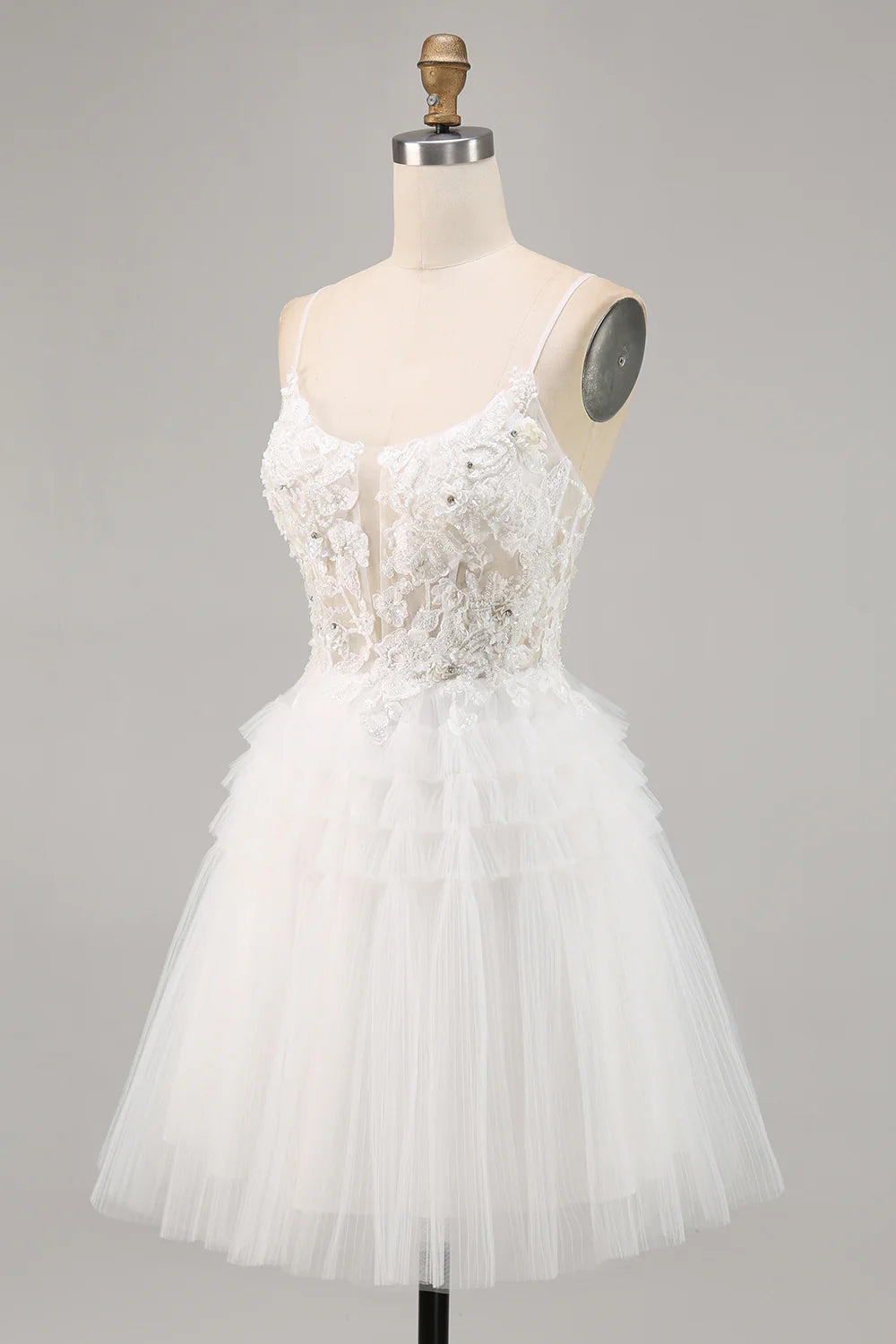 Close-up of sequin details on white tulle homecoming dress.
