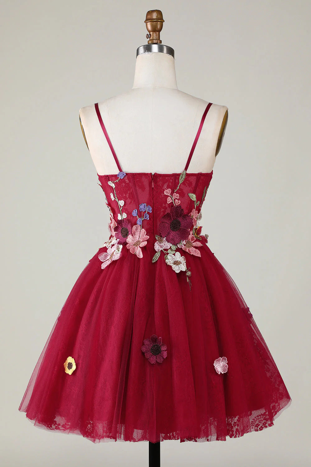 Back view of burgundy short homecoming dress with delicate 3D floral details.