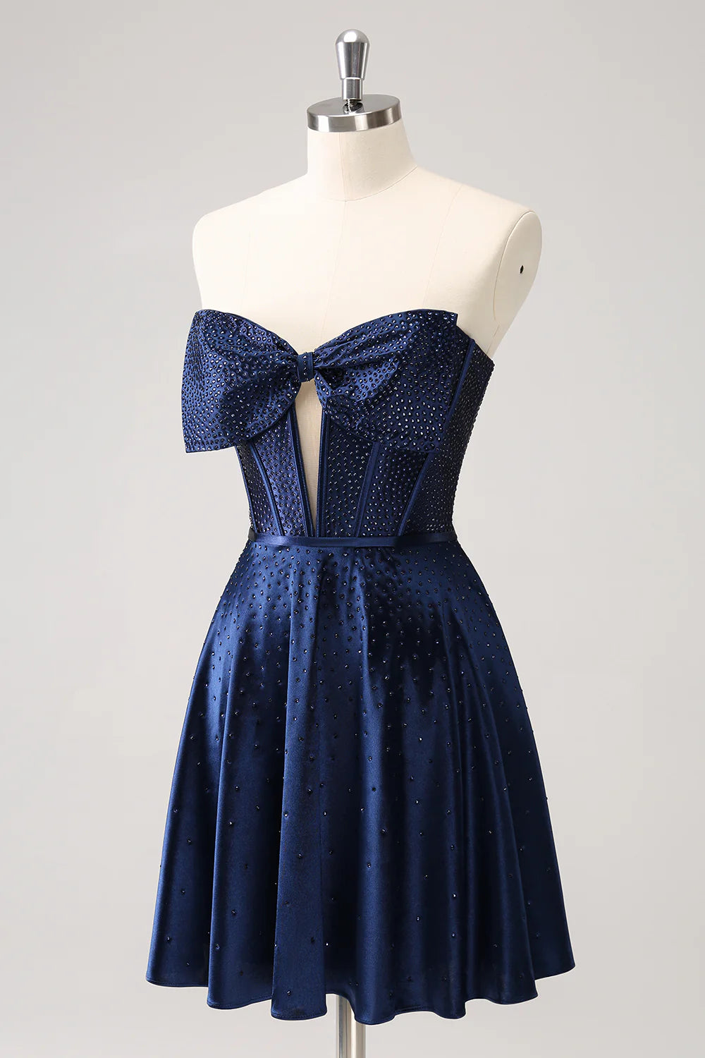 Close-up of beaded corset and hollow-out detail on navy homecoming dress.