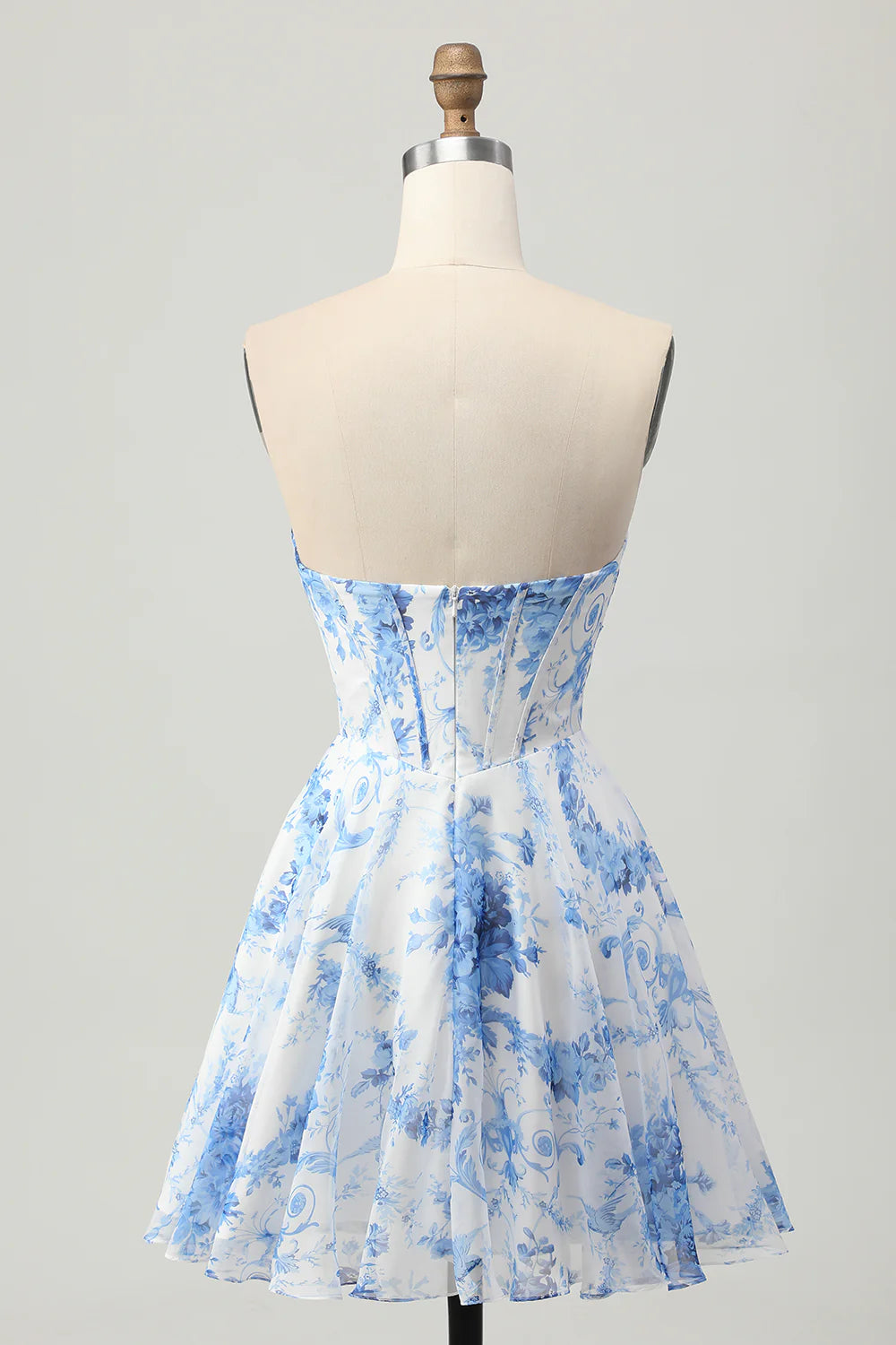 Back view of white and blue floral strapless A-line short homecoming dress.