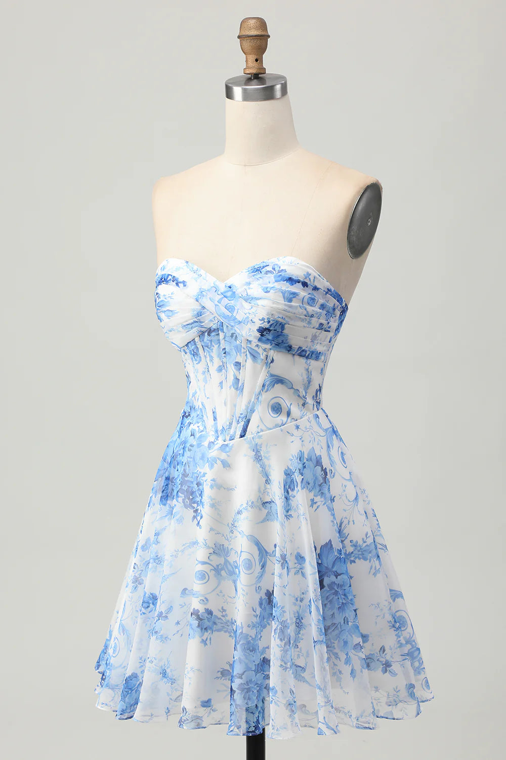 Side view of white and blue floral strapless A-line short homecoming dress.