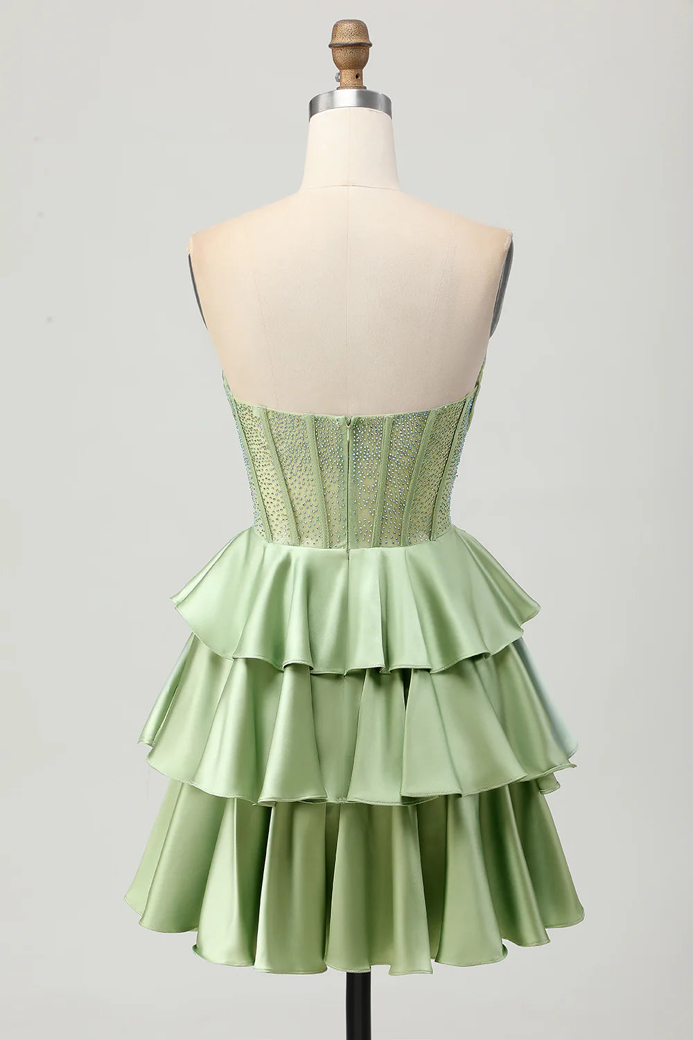 Full length view of the dark green tiered satin homecoming dress.