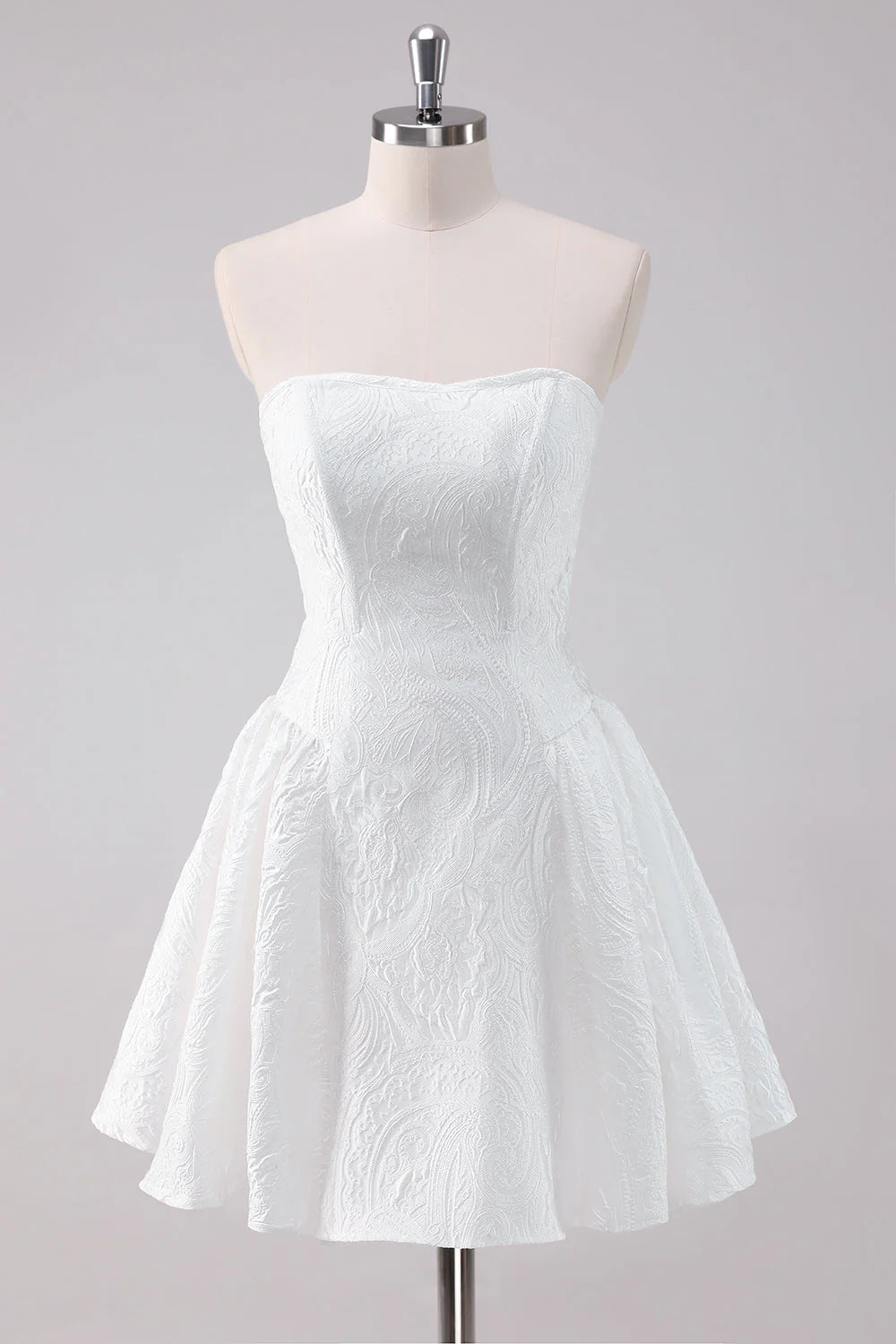 Model wearing an elegant white A-line strapless short homecoming dress with a corset bodice.