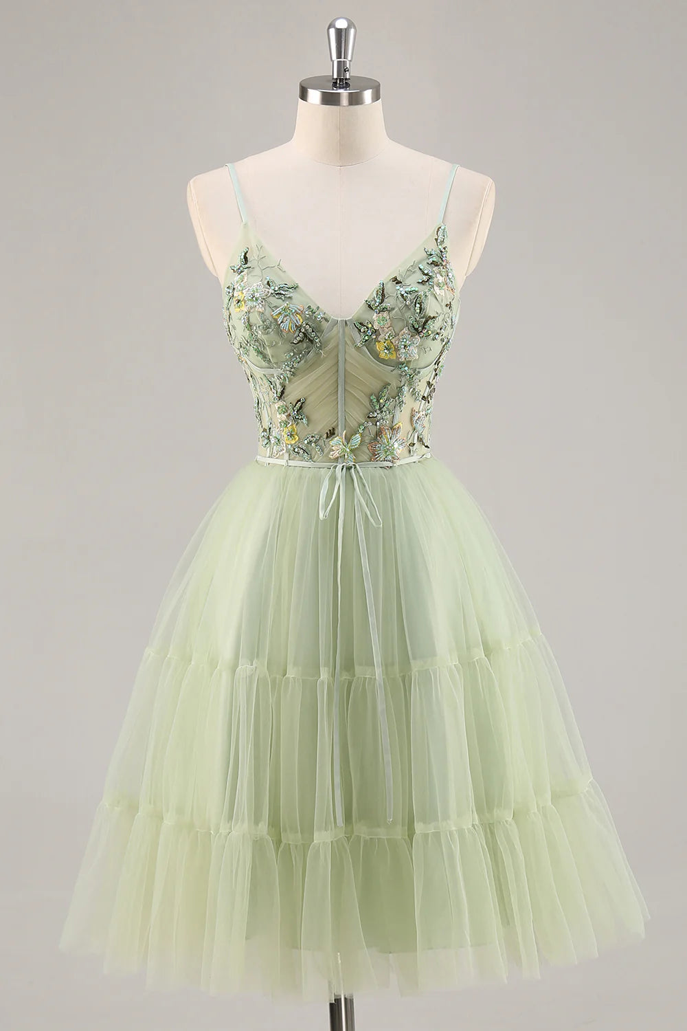 Green A-line short homecoming dress with floral embroidery and beading, front view.
