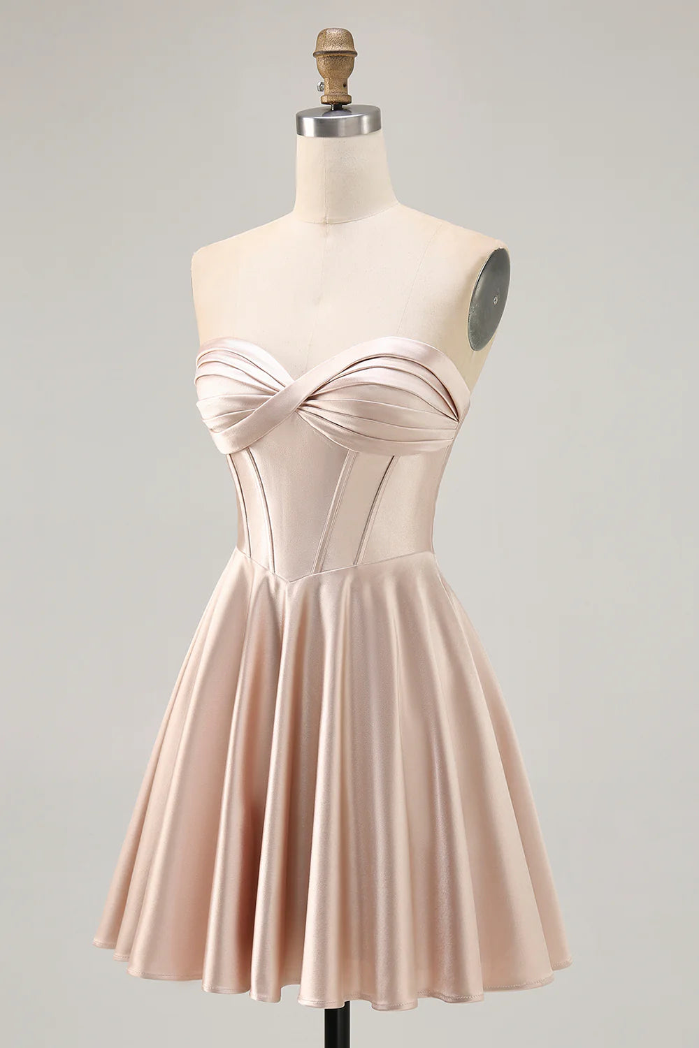 Back view of the champagne A-line strapless dress, highlighting the elegant lace-up closure.
