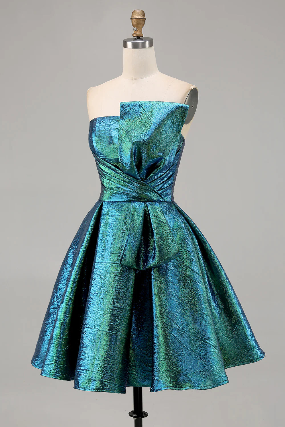 Close-up of the charming bow detail on the peacock green A-line dress.