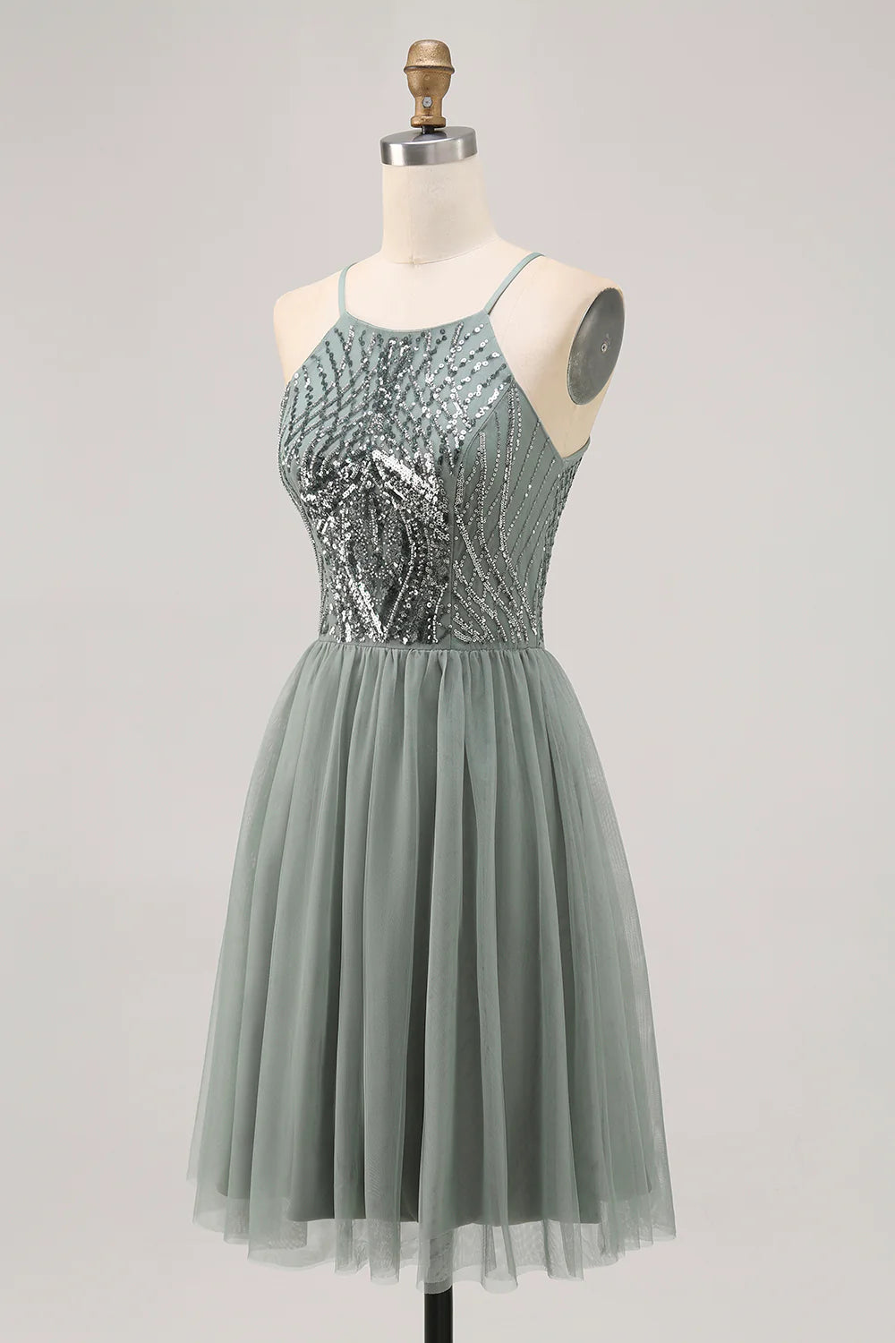 Back view of a model in a grey blue A-line sequin tulle short homecoming dress, showing the strapless design.