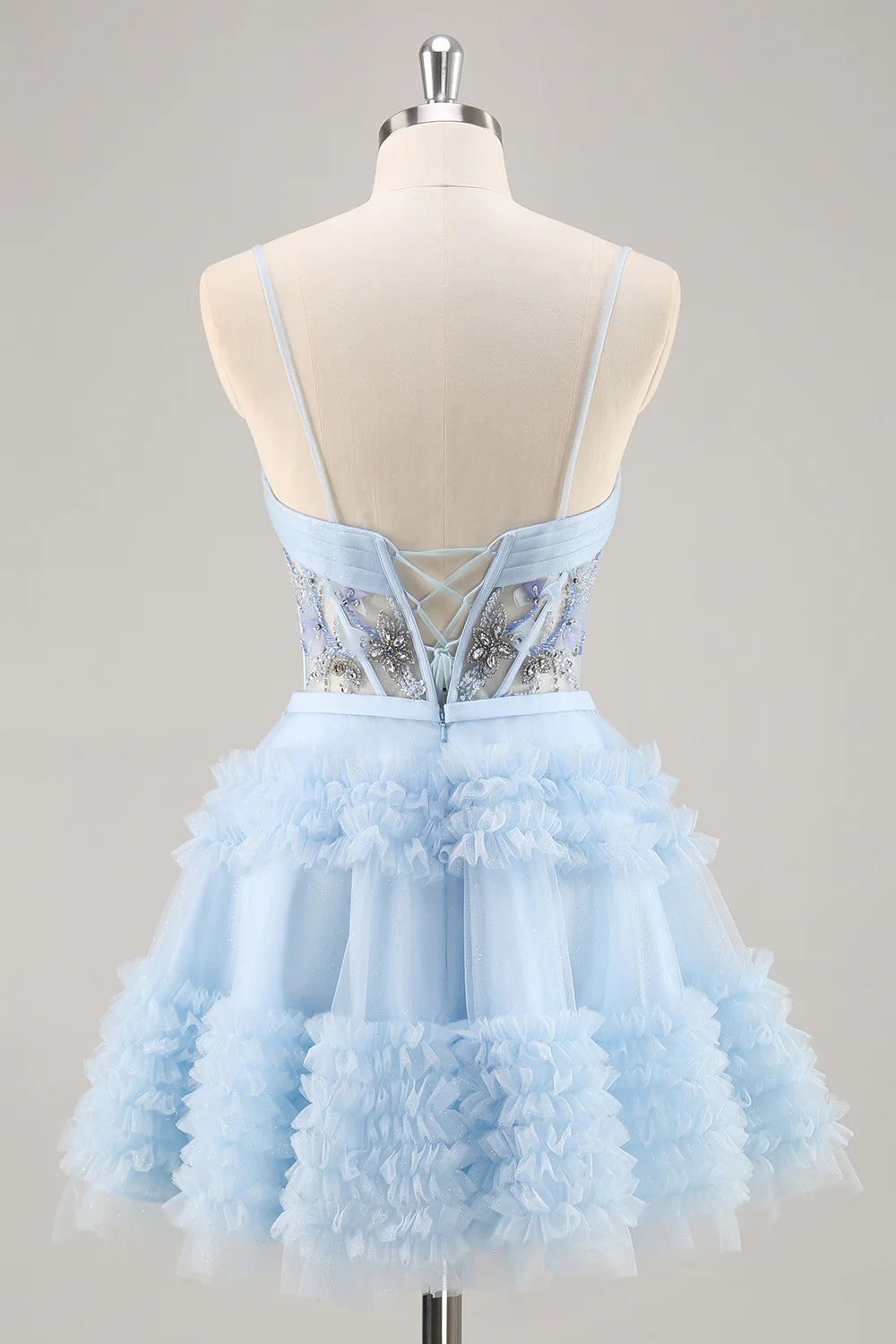 Side view of the blue A-line short homecoming dress, highlighting pleated skirt.