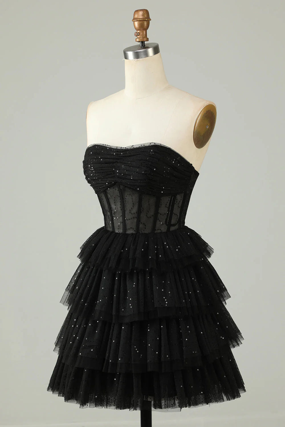 Back view of black tiered corset homecoming dress.