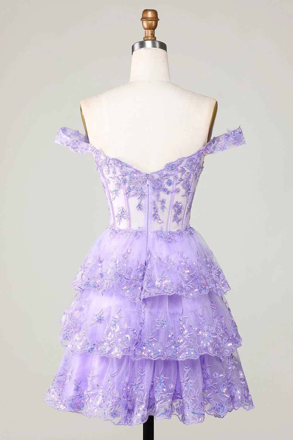 Close-up of the corset bodice and lace details on the purple homecoming dress.