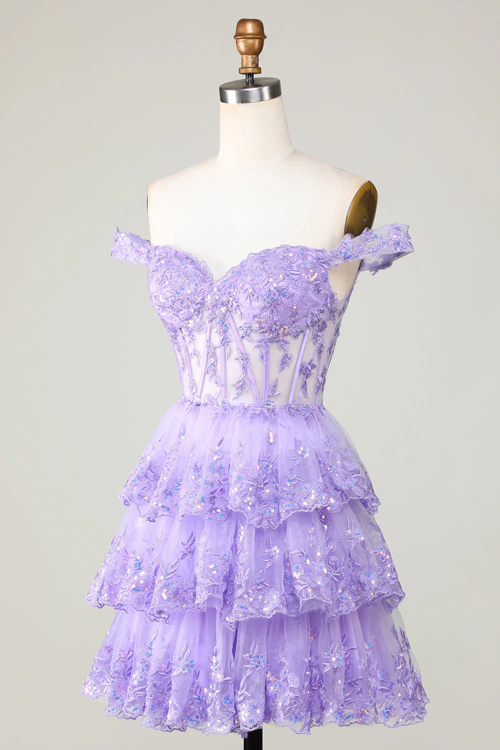 Back view of the tiered purple short homecoming dress with lace accents.