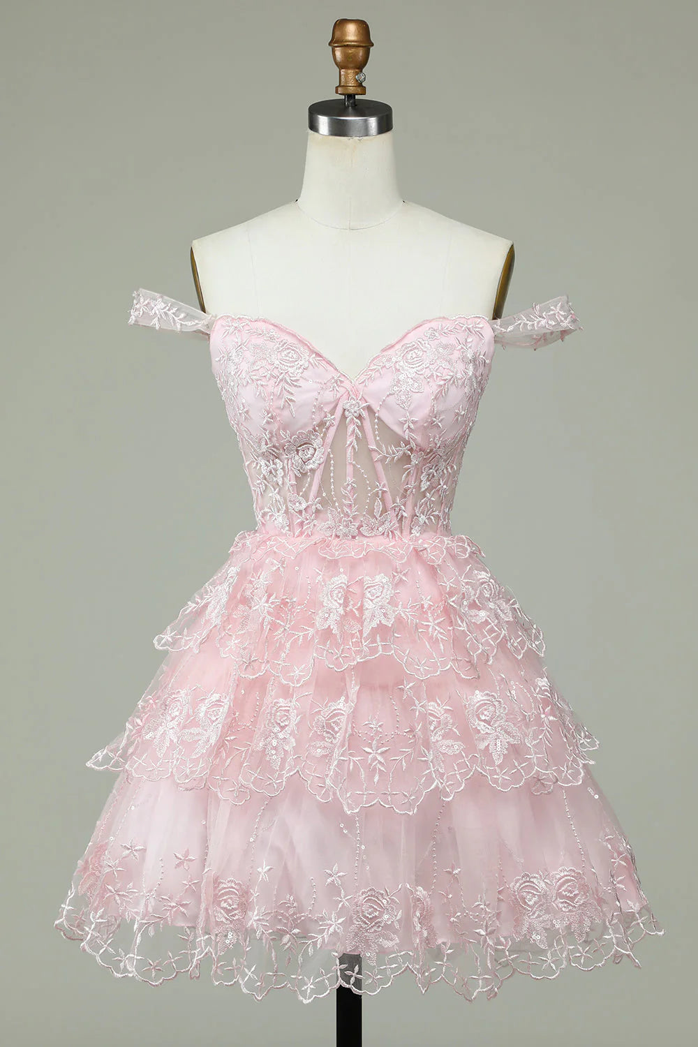 Back view of the tiered pink short homecoming dress.