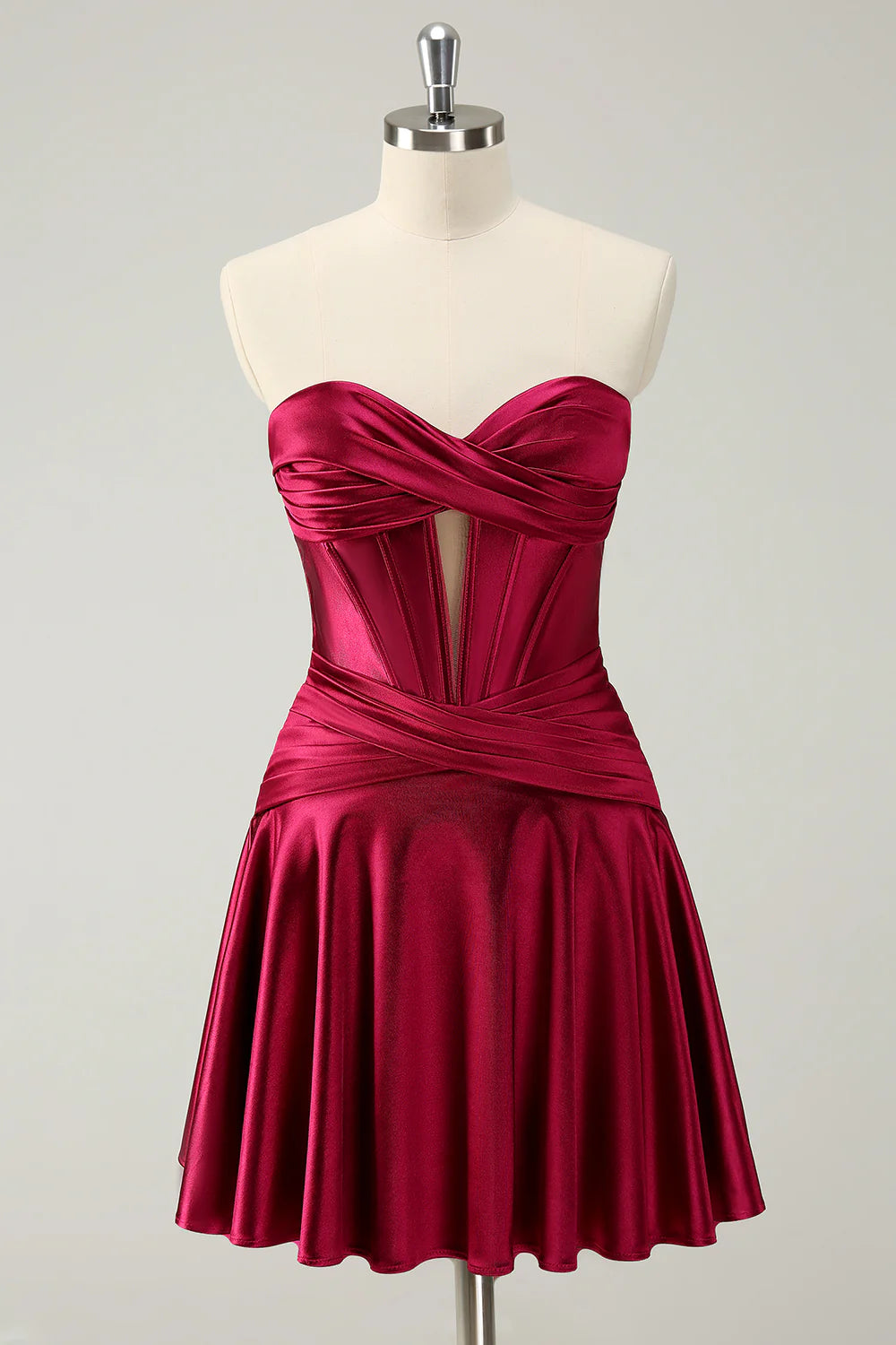 Burgundy A-line homecoming dress with sweetheart neckline, criss-cross corset, and ruffles.