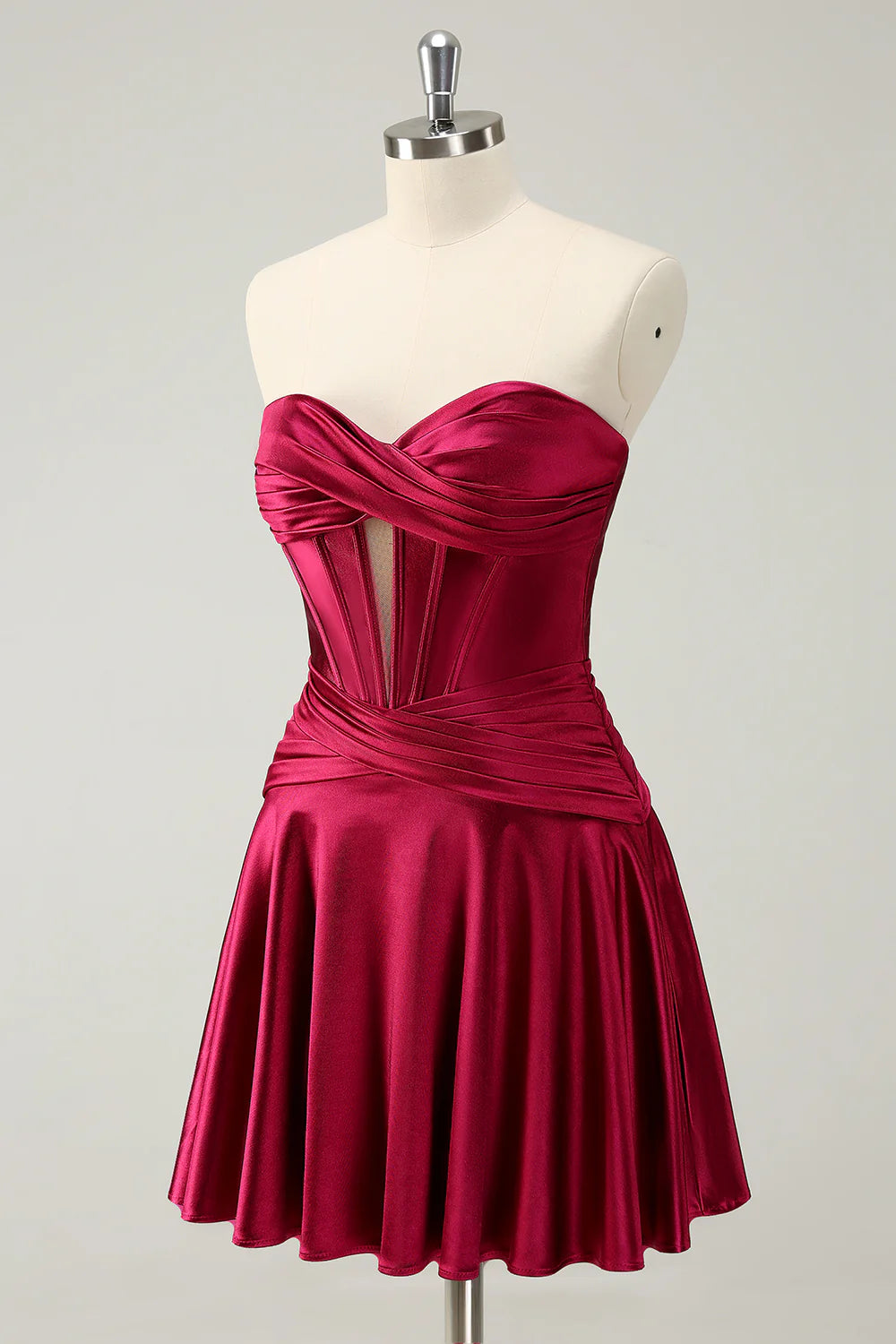 Side view of a burgundy A-line homecoming dress highlighting the ruffled skirt detail.