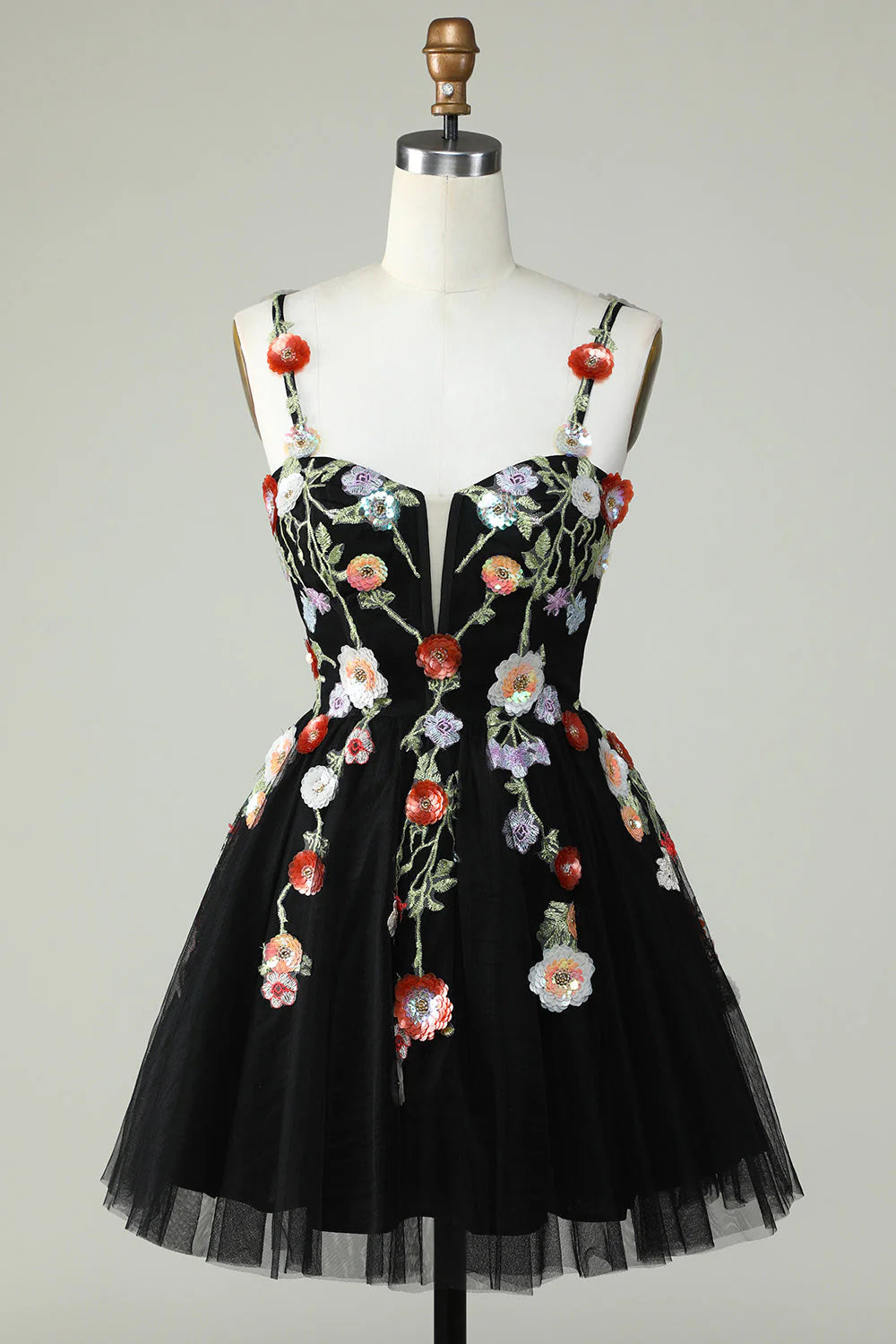 Elegant black A-line homecoming dress with spaghetti straps and sequin floral details.