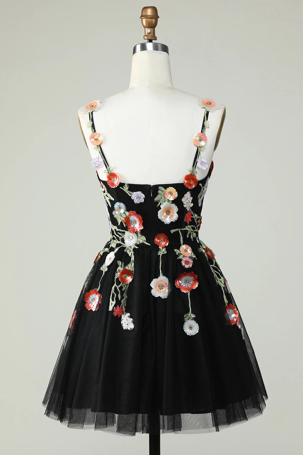 Back view of a black A-line sequin homecoming dress with delicate straps.