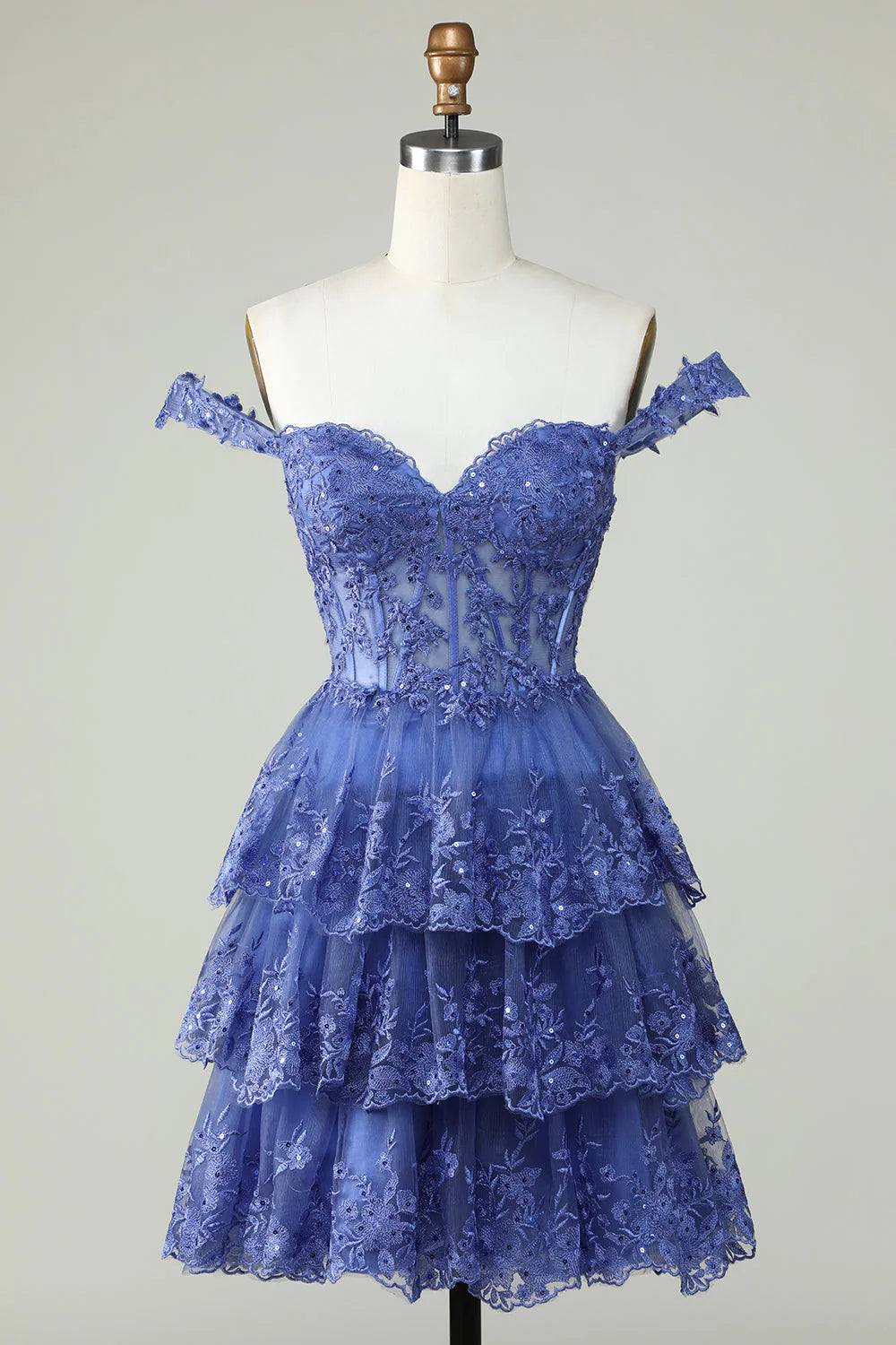 Elegant dark blue A-line homecoming dress with sweetheart strapless neckline and tiered skirt.