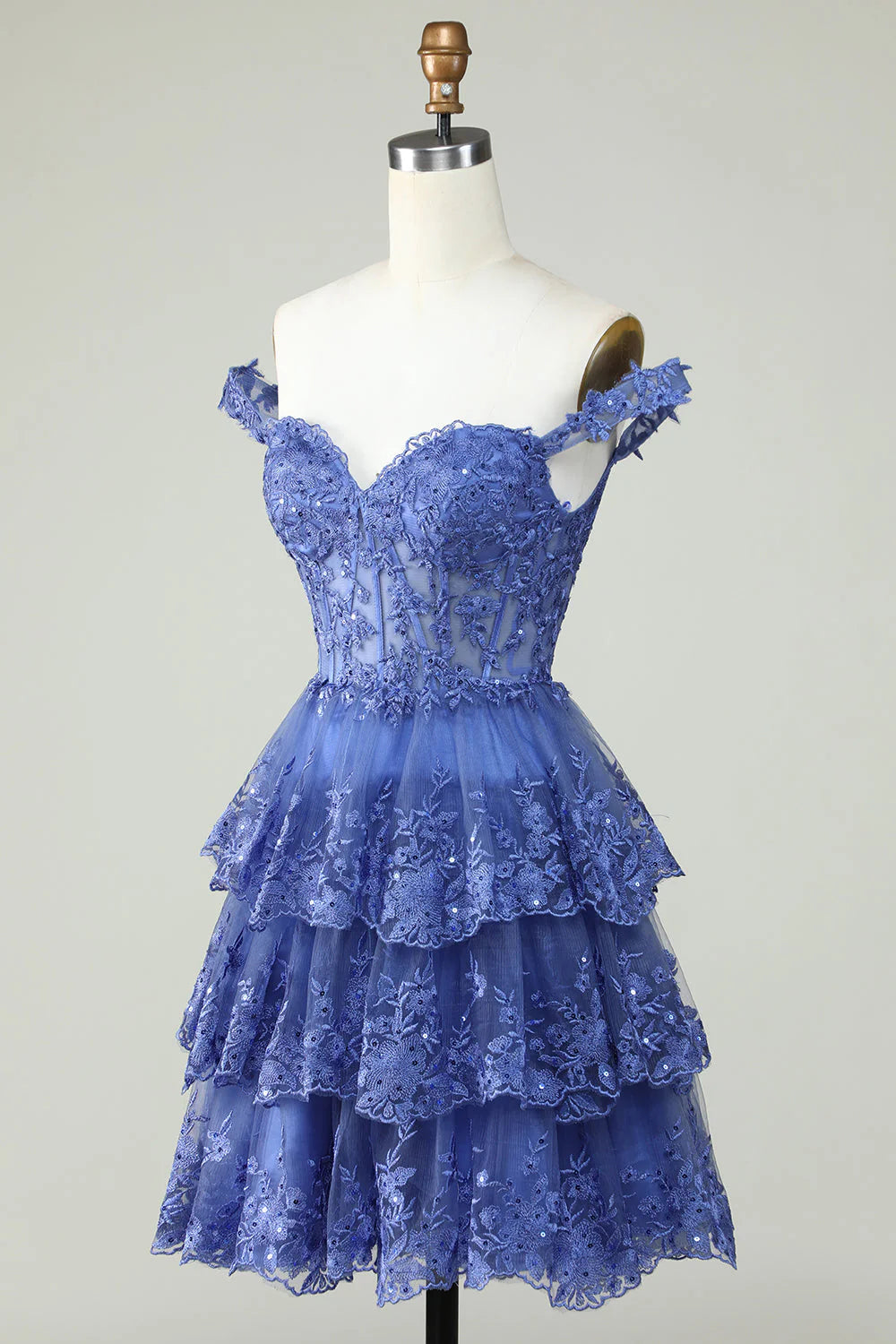 Side view of the dark blue short homecoming dress, highlighting the lace corset bodice.