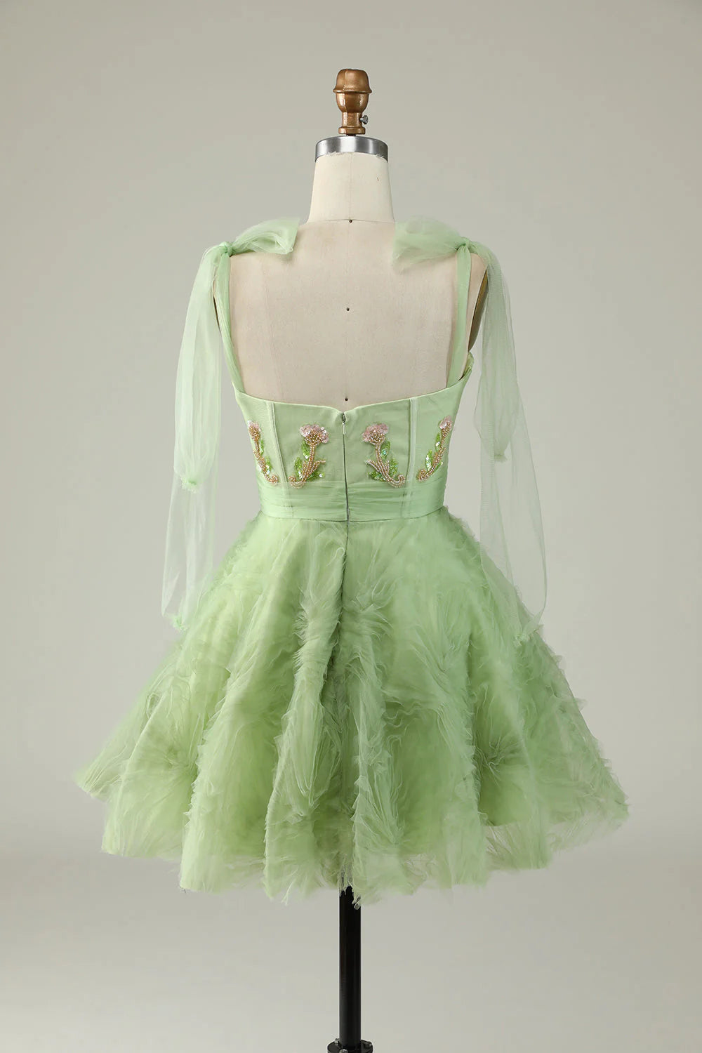 Elegant green A-line dress for homecoming, adorned with sparkling appliques and sequins.