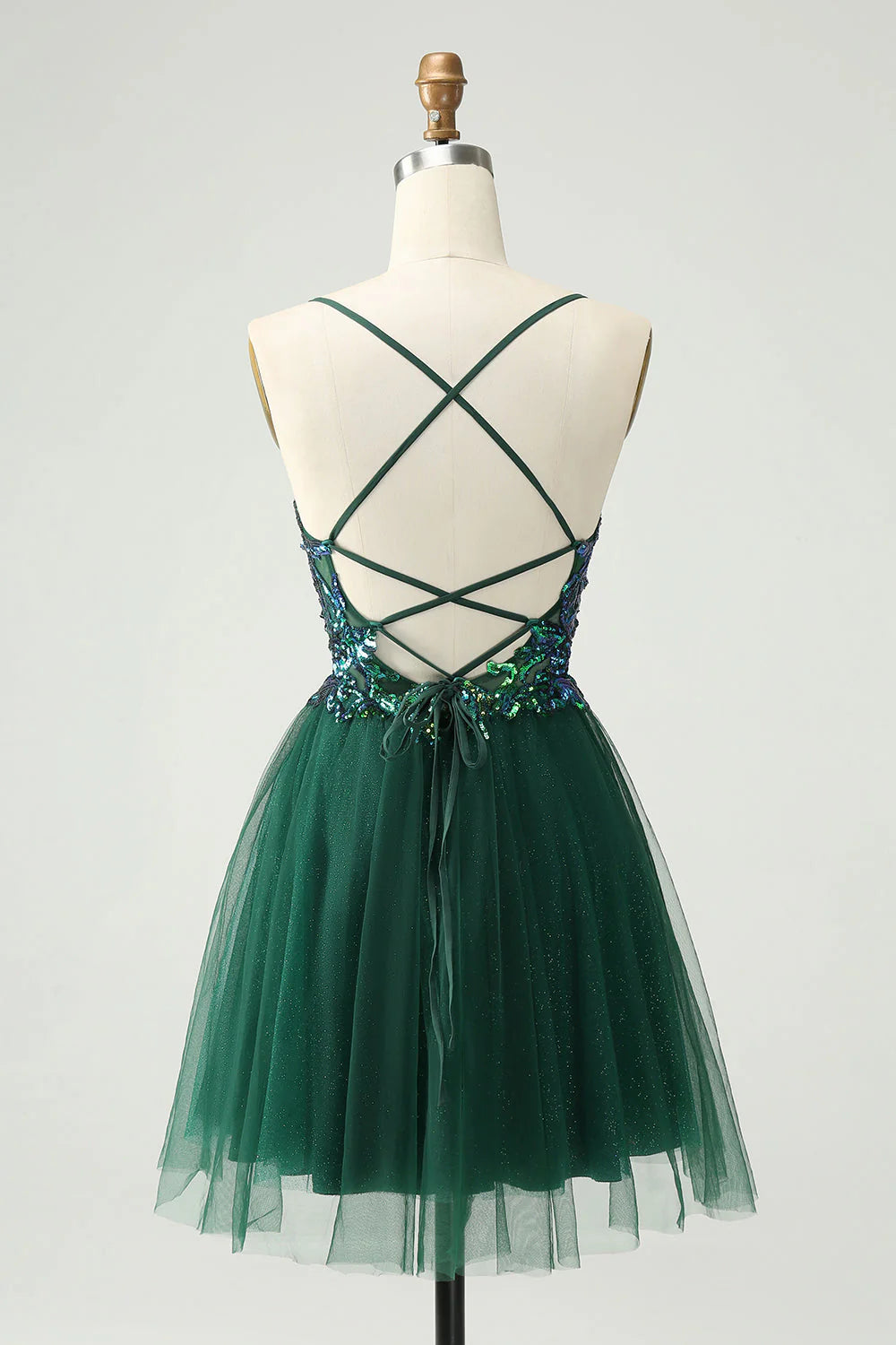 Side view of a dark green A-line V-neck sequin short homecoming dress with appliques.
