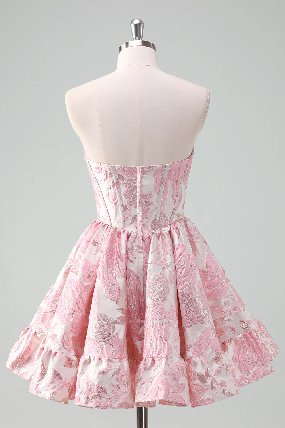 Side view of a blush sweetheart satin ball gown showcasing the ruffle design.