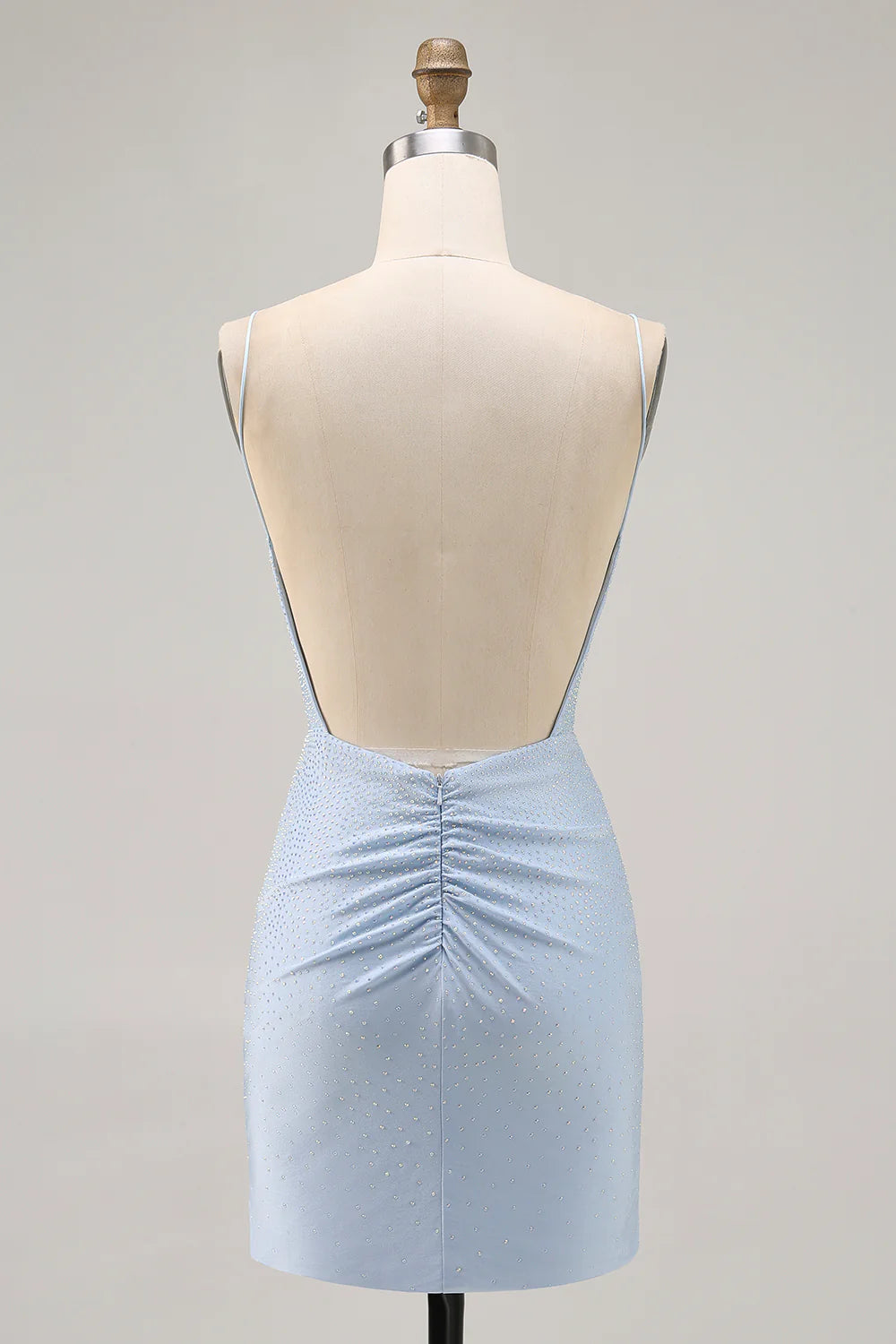Back view of the blue bodycon short dress, highlighting the backless design.