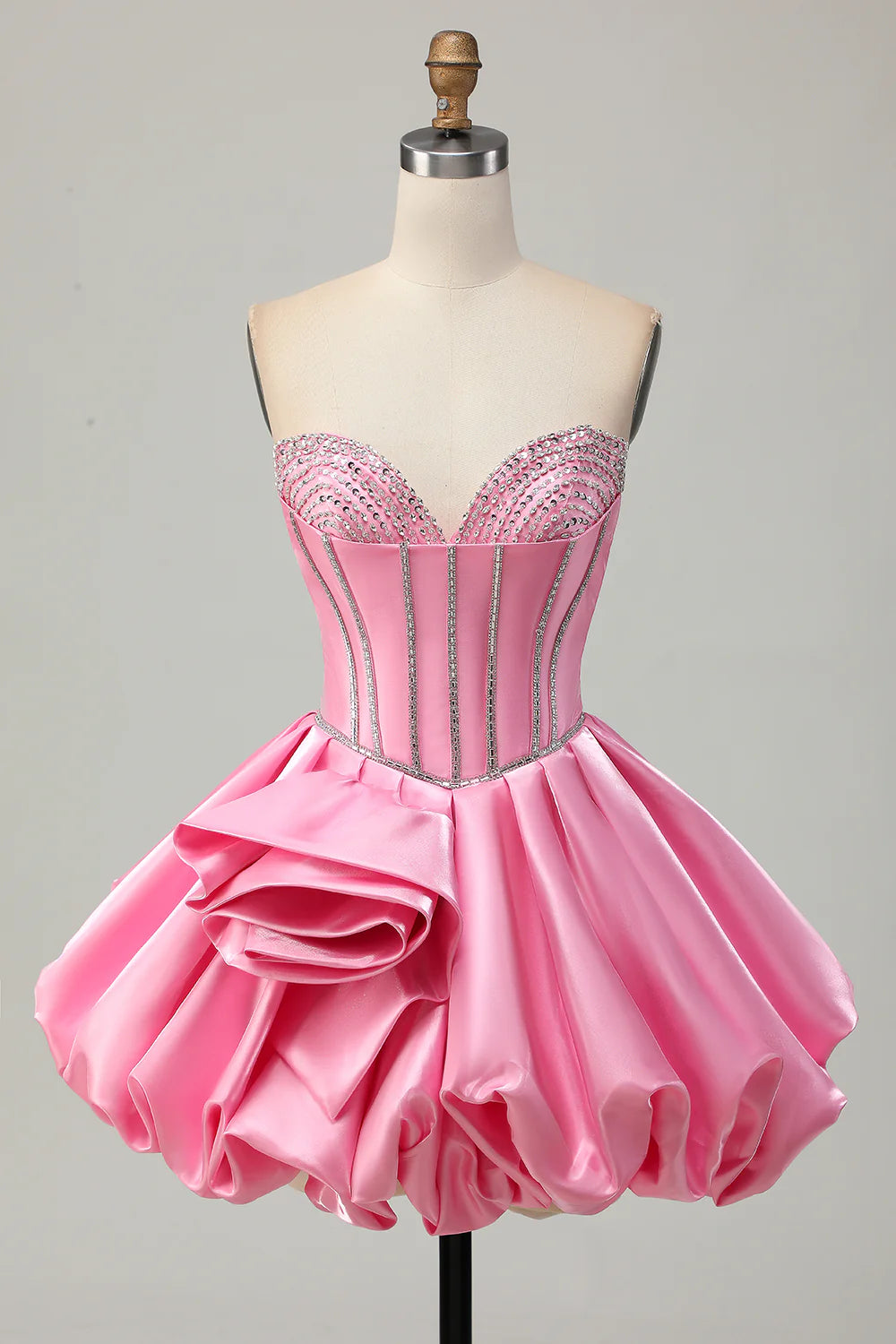 Pink A-line homecoming dress with corset bodice and ruffles.