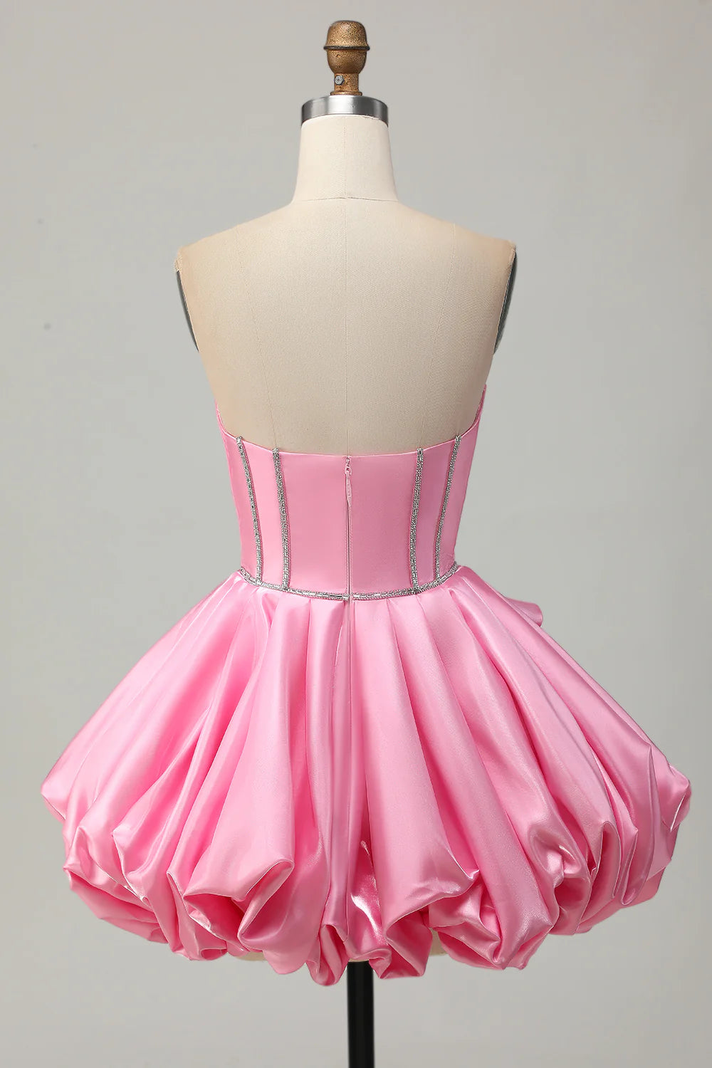 Back view of pink strapless short homecoming dress with beading.