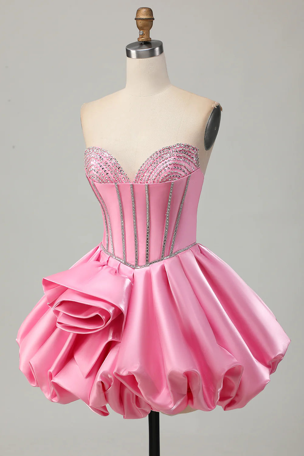Side view of elegant pink ruffled homecoming dress.