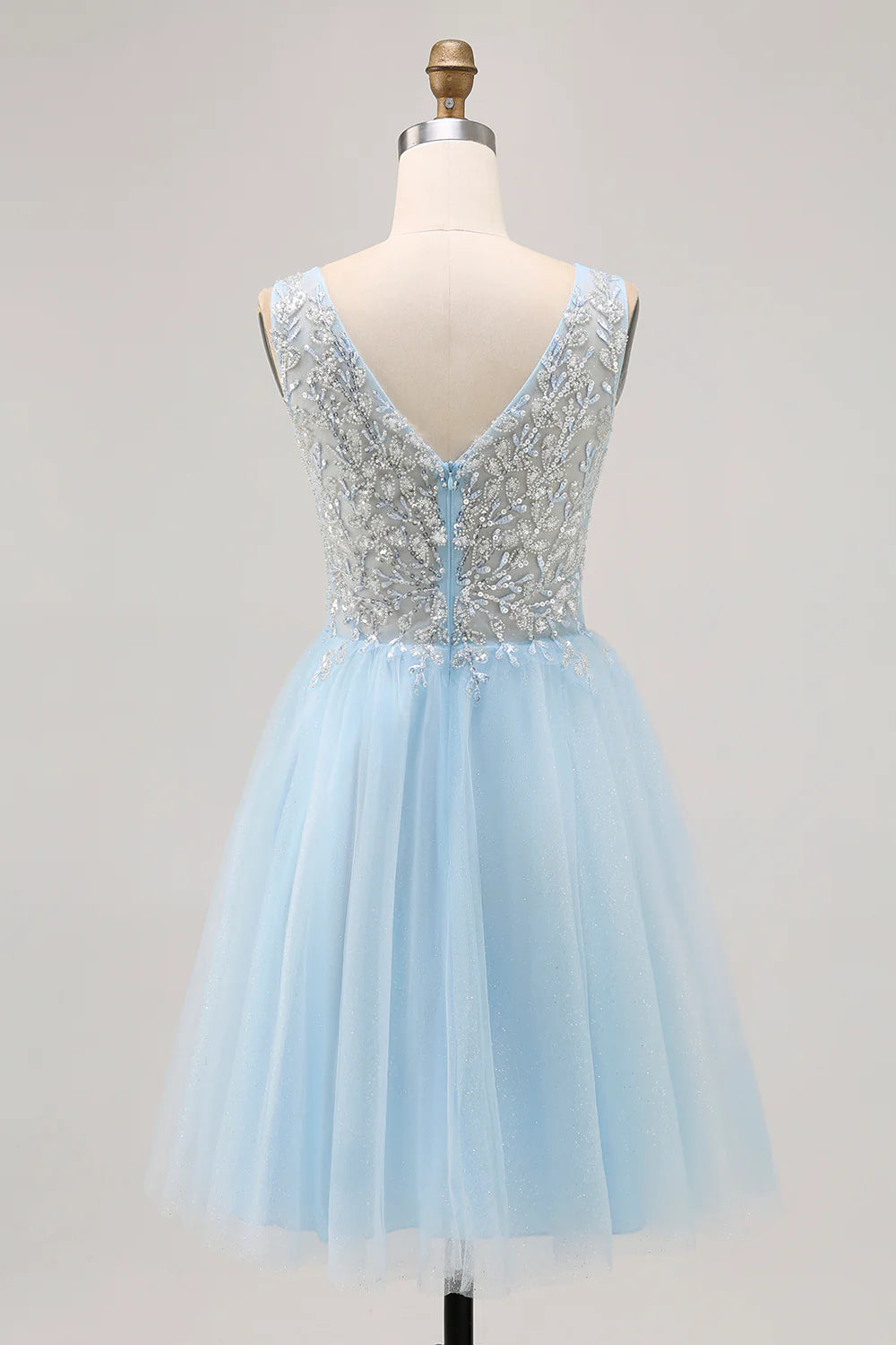 Model wearing a blue A-line V-neck floral appliqued short homecoming dress.