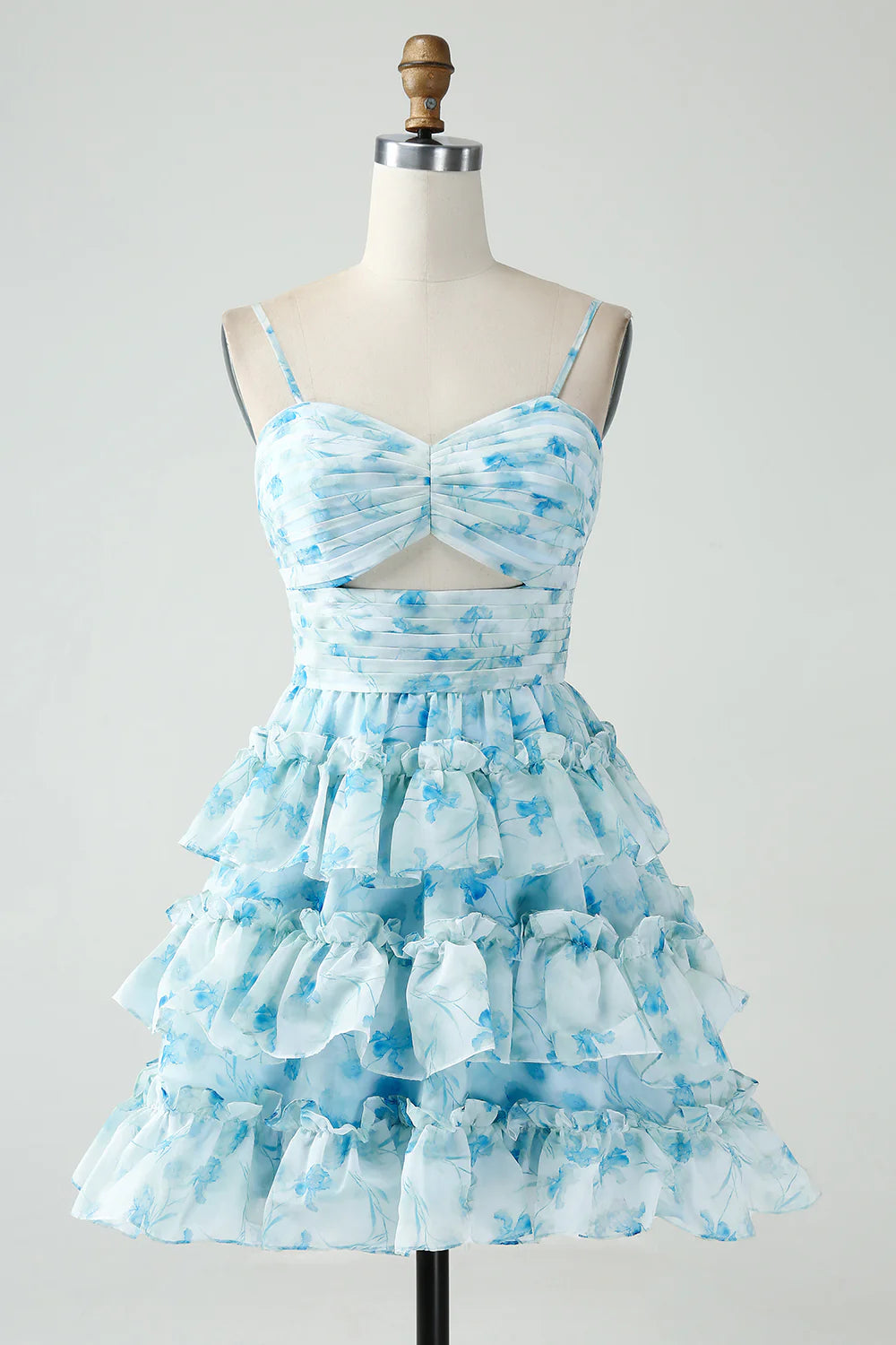 Model wearing an elegant blue floral A-line tiered pleated short homecoming dress.