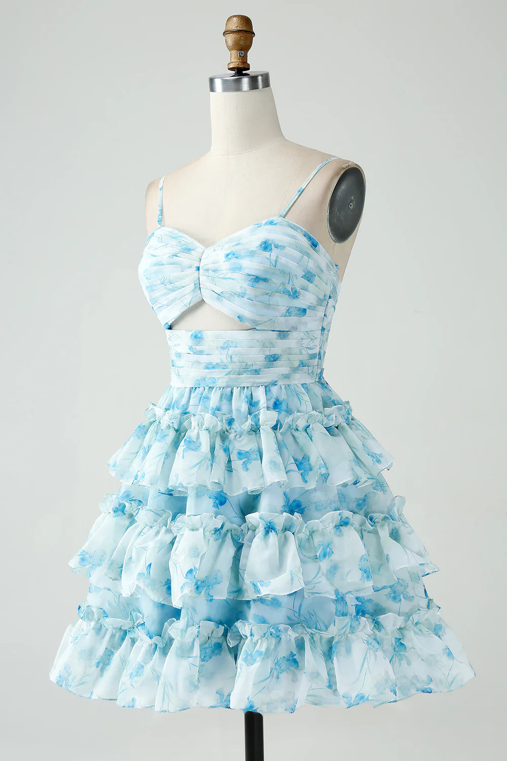 Back view of a blue floral A-line tiered pleated short homecoming dress.