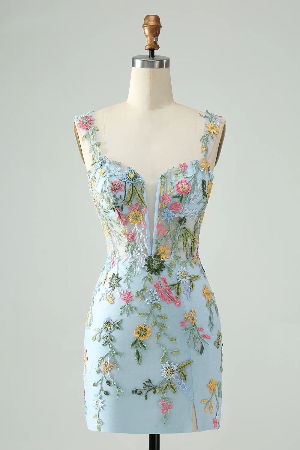 Close-up of blue floral embroidery on the mermaid homecoming dress.