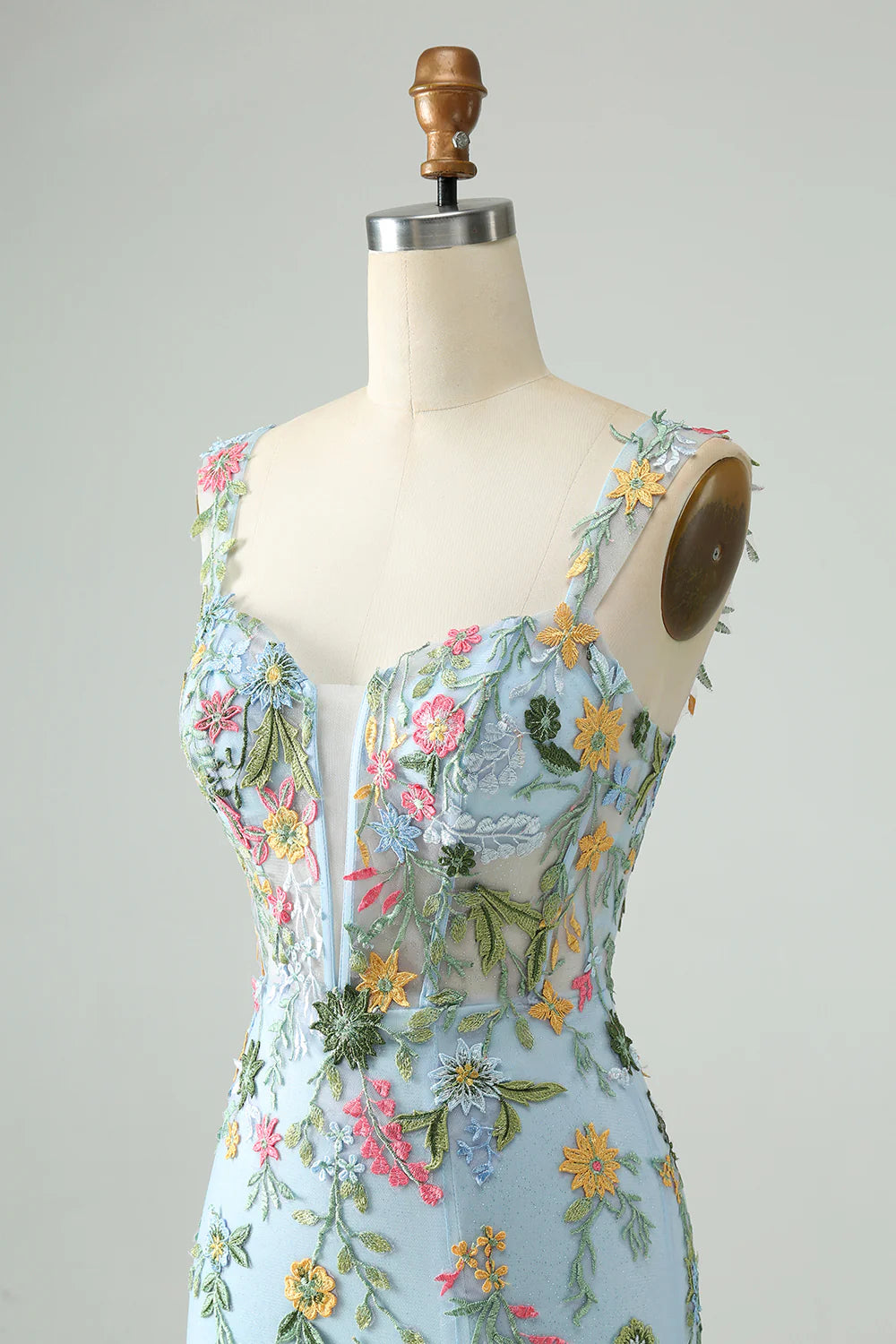 Side view of blue floral mermaid dress showcasing the short length.