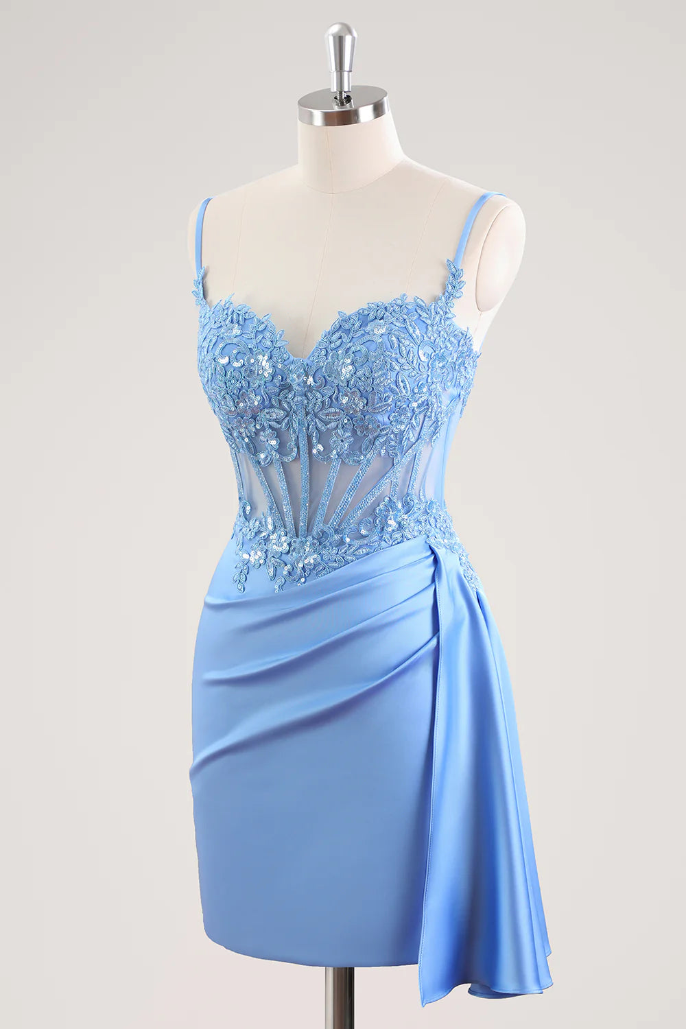Side view of a short blue beaded sheath dress.