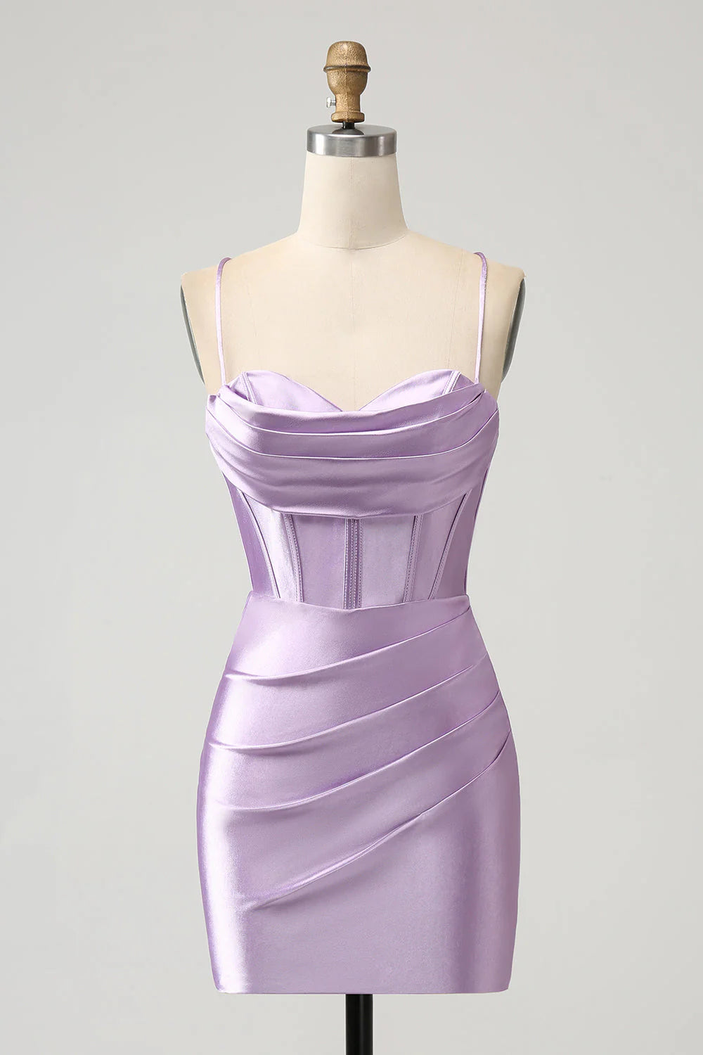 Model wearing a lilac bodycon satin short homecoming dress with spaghetti straps and corset detail.