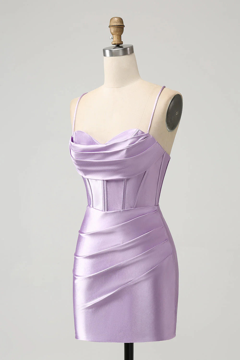 Side profile of a woman in a lilac bodycon satin homecoming dress.