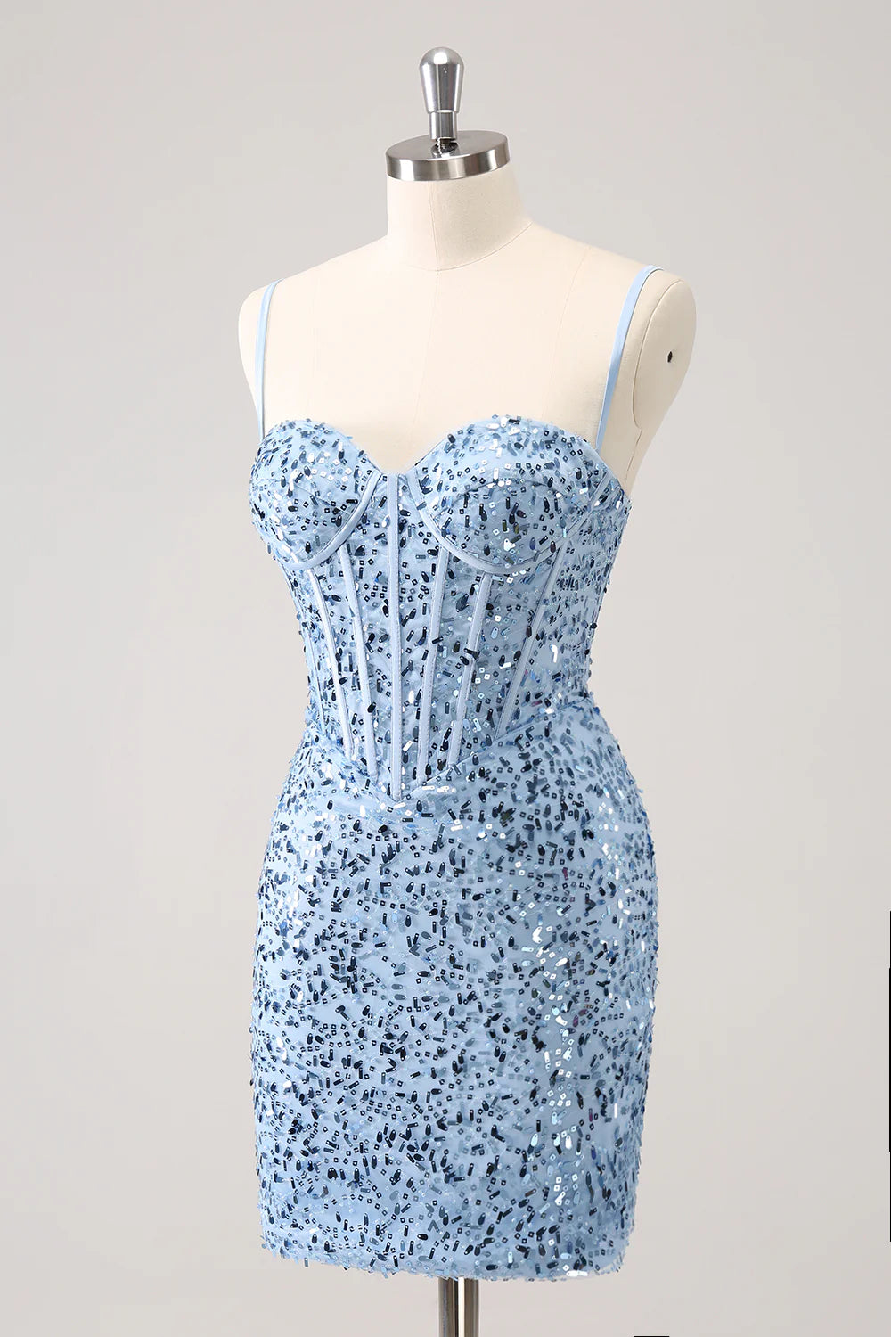 Close-up of the shimmering sequins and satin fabric on the blue bodycon dress.