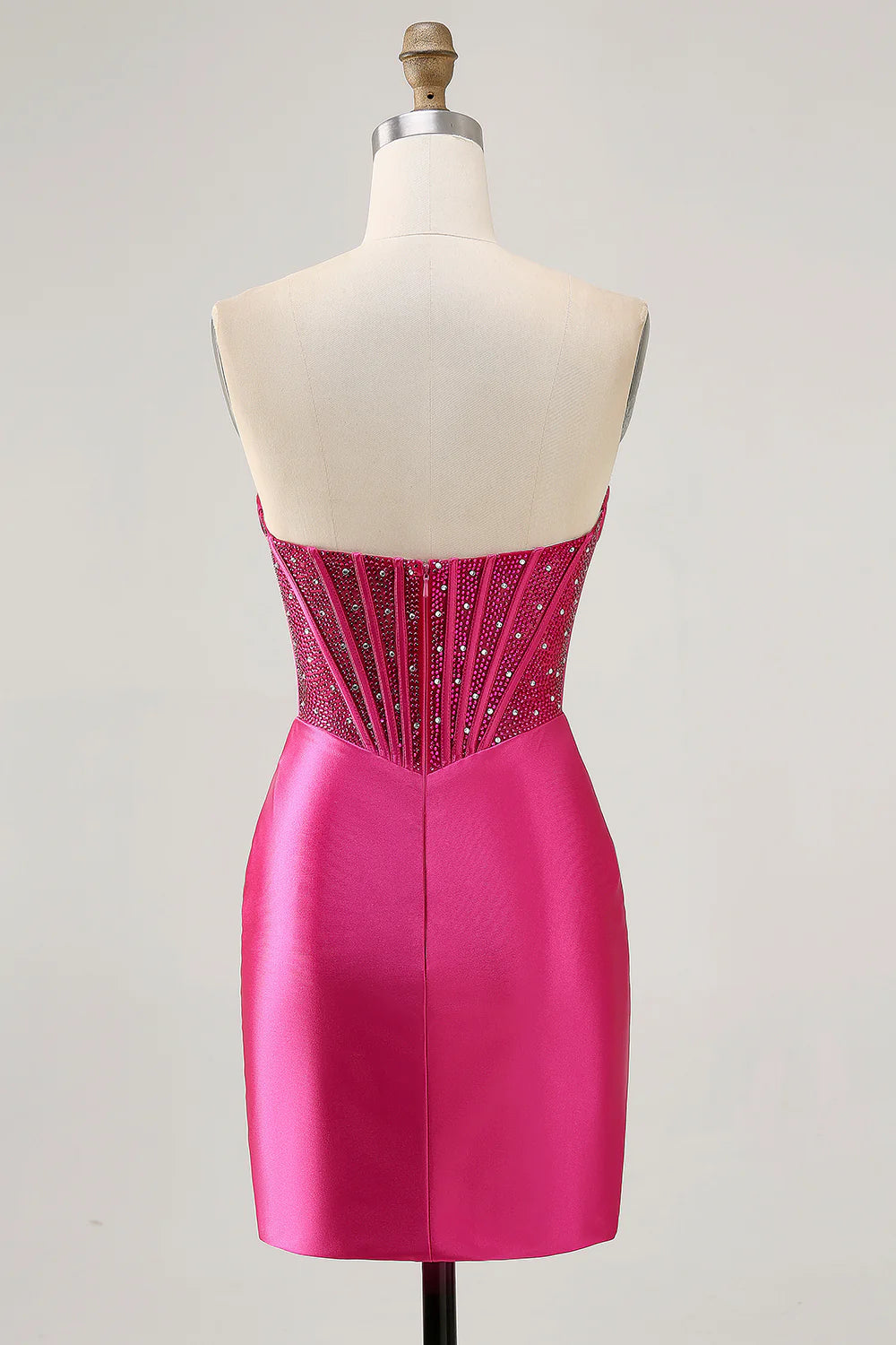 Side view of fuchsia strapless bodycon dress.